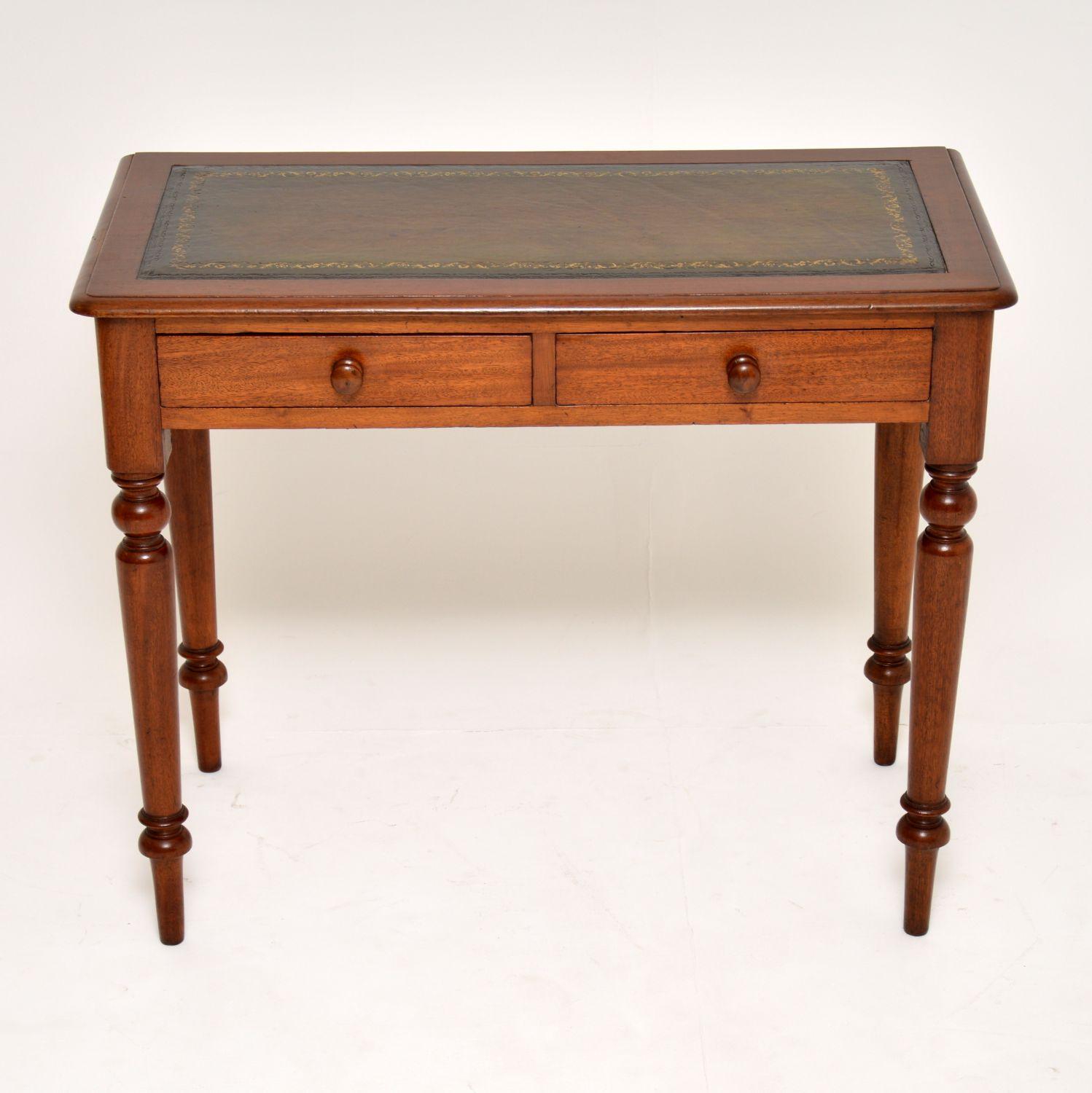 Antique Victorian mahogany writing table with a tooled leather writing surface. It’s in very good original condition and dates to circa 1860-1880s period. There are two drawers with turned bun handles and it sits on turned legs.

Measures: Width –