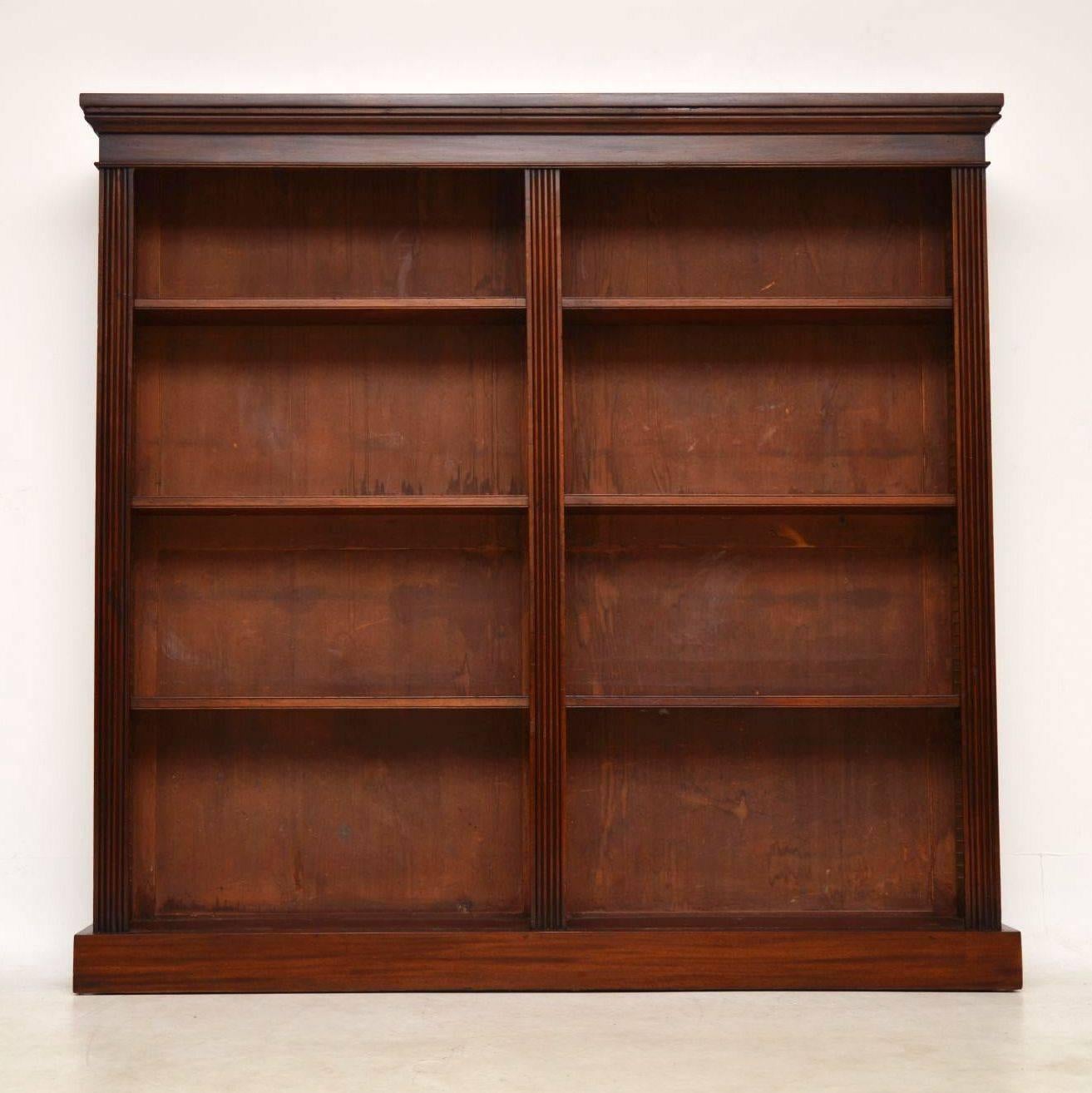 This antique Victorian mahogany open bookcase is very slim in depth, so won’t hold particularly deep books. It’s very smart looking with two compartments that have fully adjustable shelves. The front edges are reeded and it sits on a plinth base.