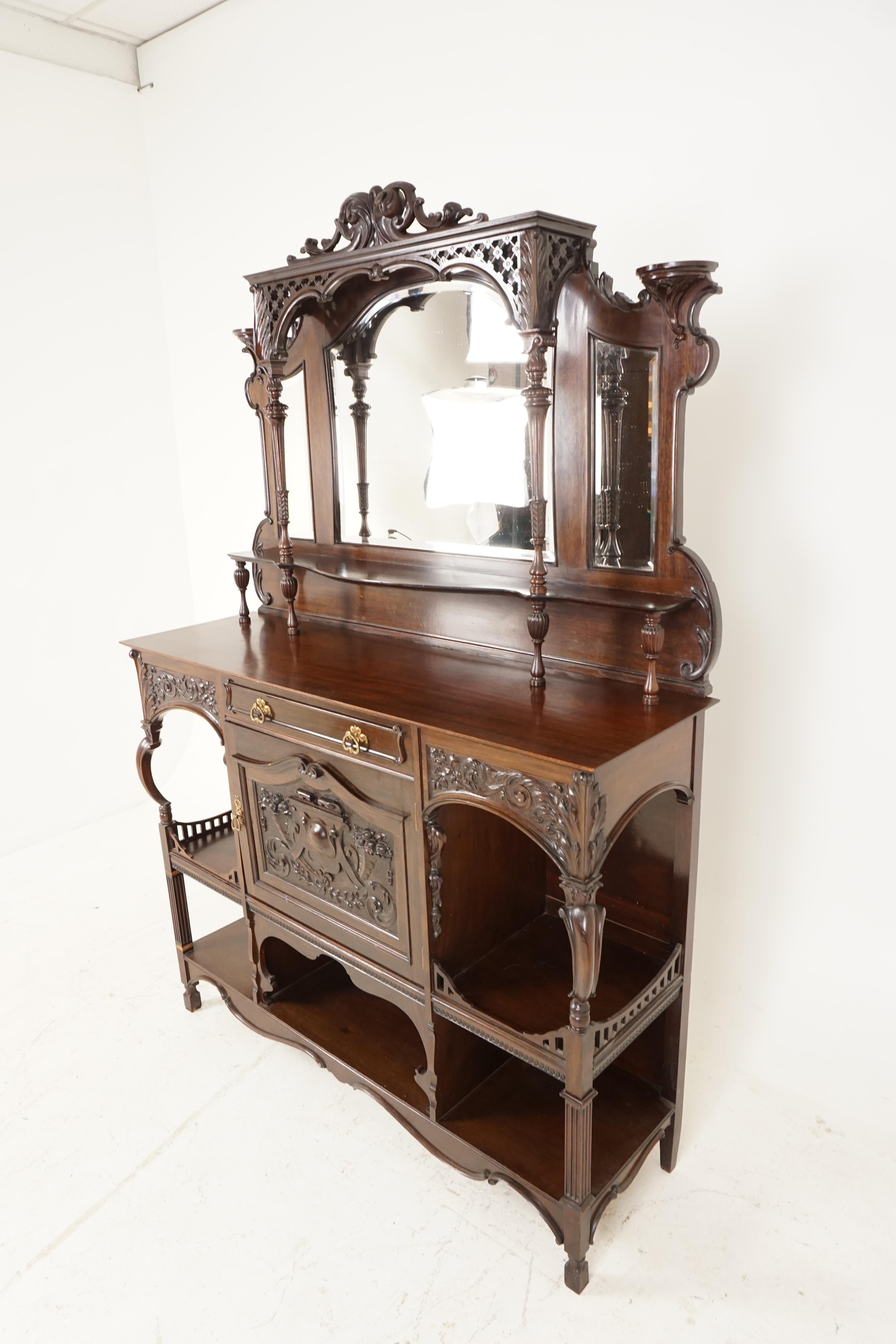 Antique Victorian Walnut parlour, side display cabinet, Scotland, 1880, B2261

Scotland, 1880
Solid Walnut 
Original finish
Carved pediment on top
Pair of half circular candleholders on sides of top
Large shaped beveled mirror in the centre
Flanked