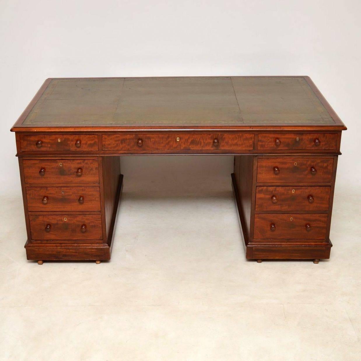 Antique Victorian mahogany partners pedestal desk, dating from the 1840-1860 period and in good condition. These type of desks are getting very hard to find these days and this one is a very nice example. The tooled leather writing surface was on