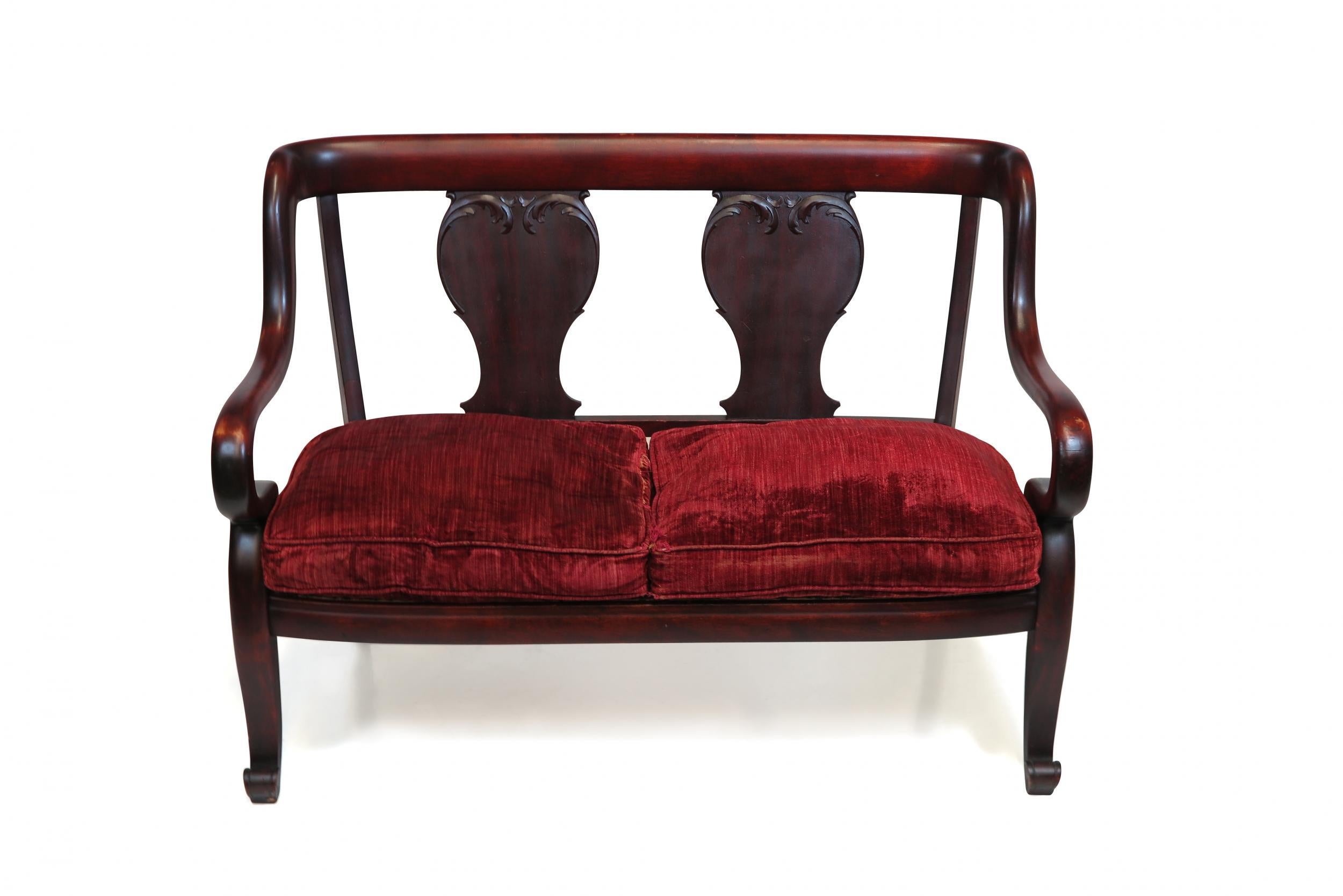 Victorian settee crafted of solid mahogany, with curved arms. Upholstery recommended.