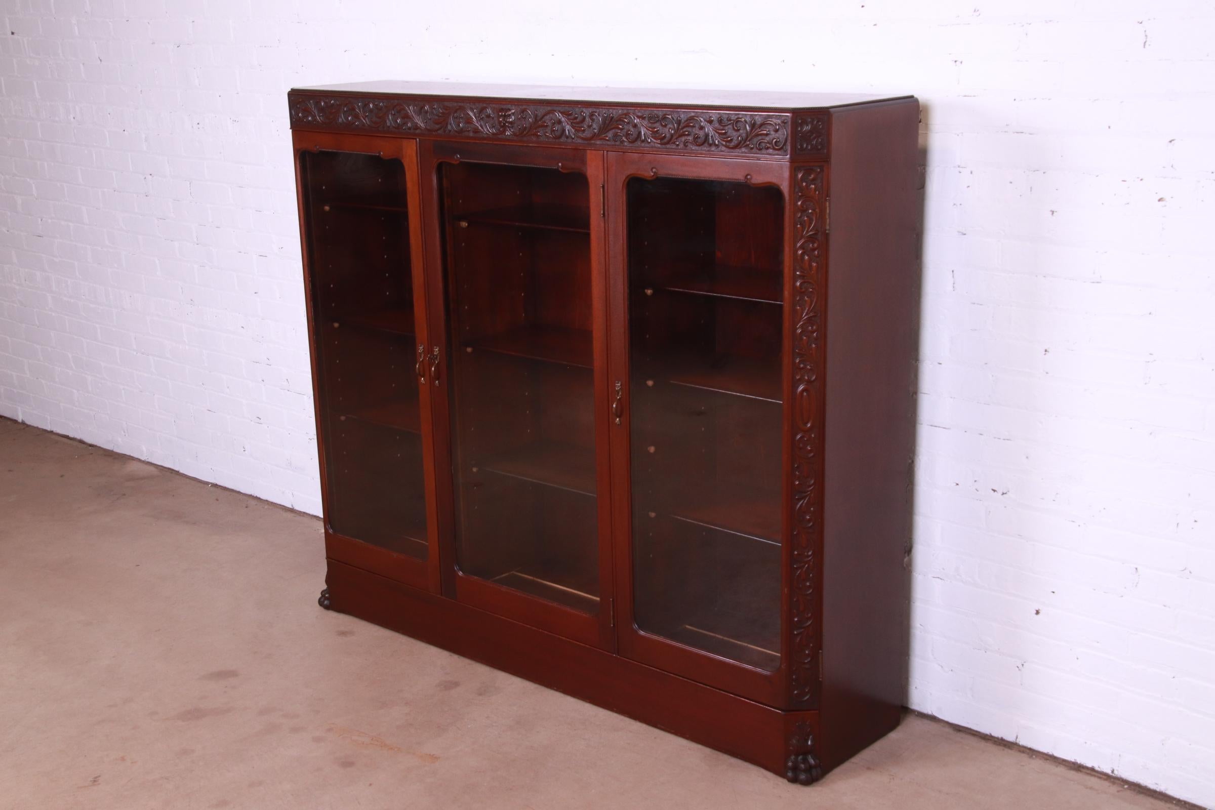 American Antique Victorian Mahogany Triple Bookcase with Old Man of the North Carving
