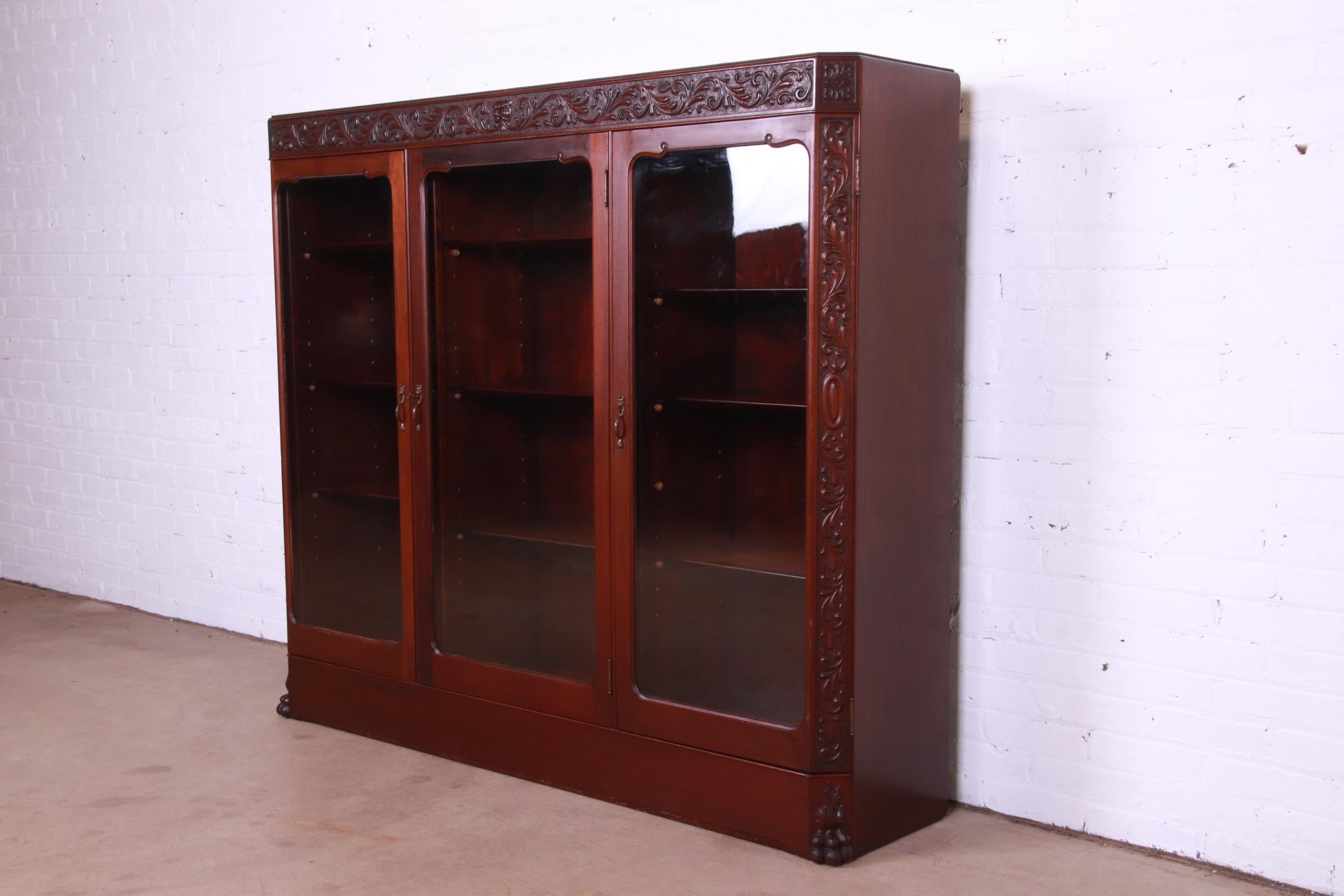 Antique Victorian Mahogany Triple Bookcase with Old Man of the North Carving In Good Condition In South Bend, IN