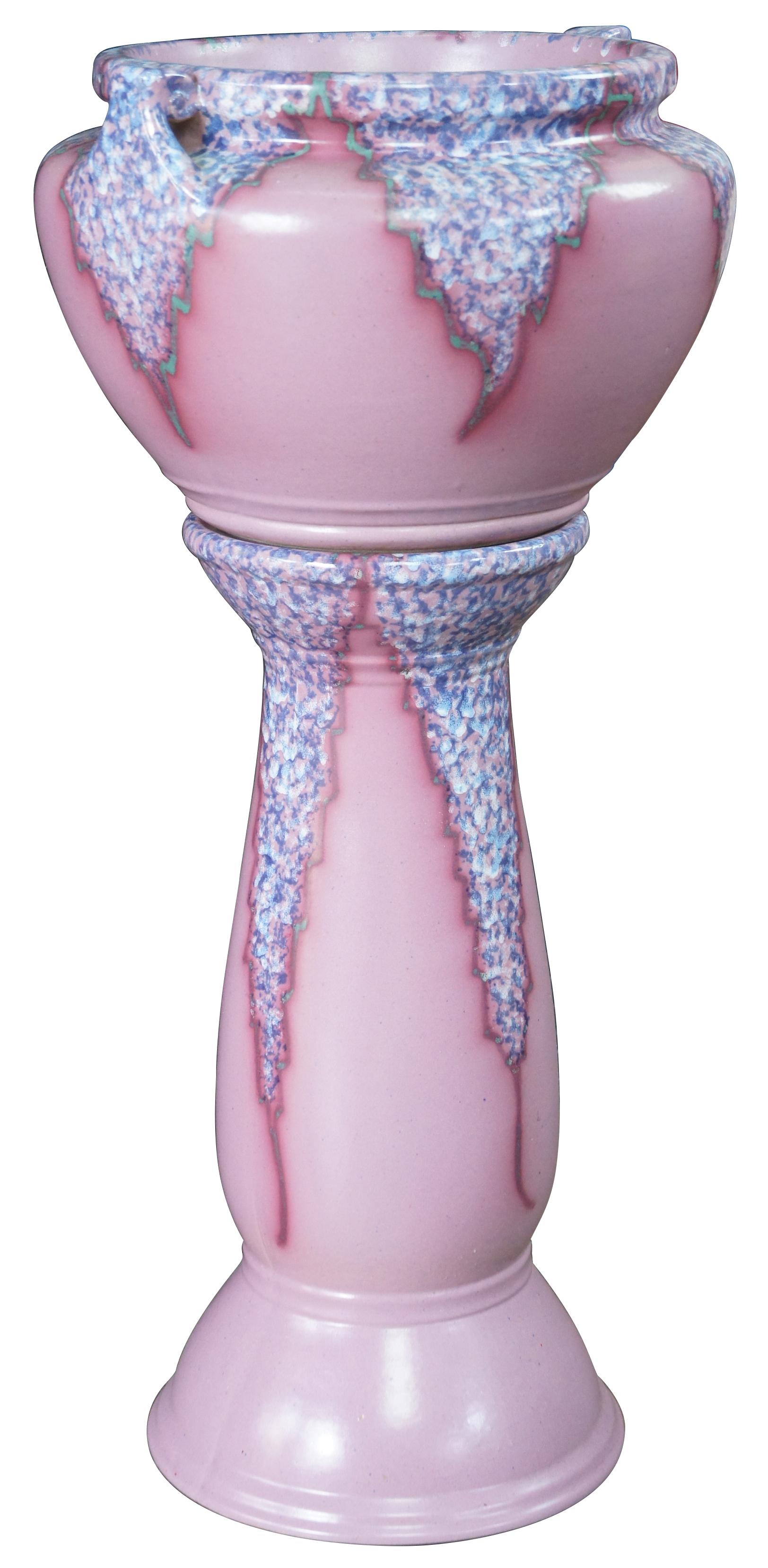 An exquisite Art Deco ceramic handled jardiniere and pedestal by Weller Pottery.  Features a mottled purple southwestern design throughout.  

Samuel Augustus Weller, founder of the seventy-year Ohio enterprise of Weller Pottery, began with simple