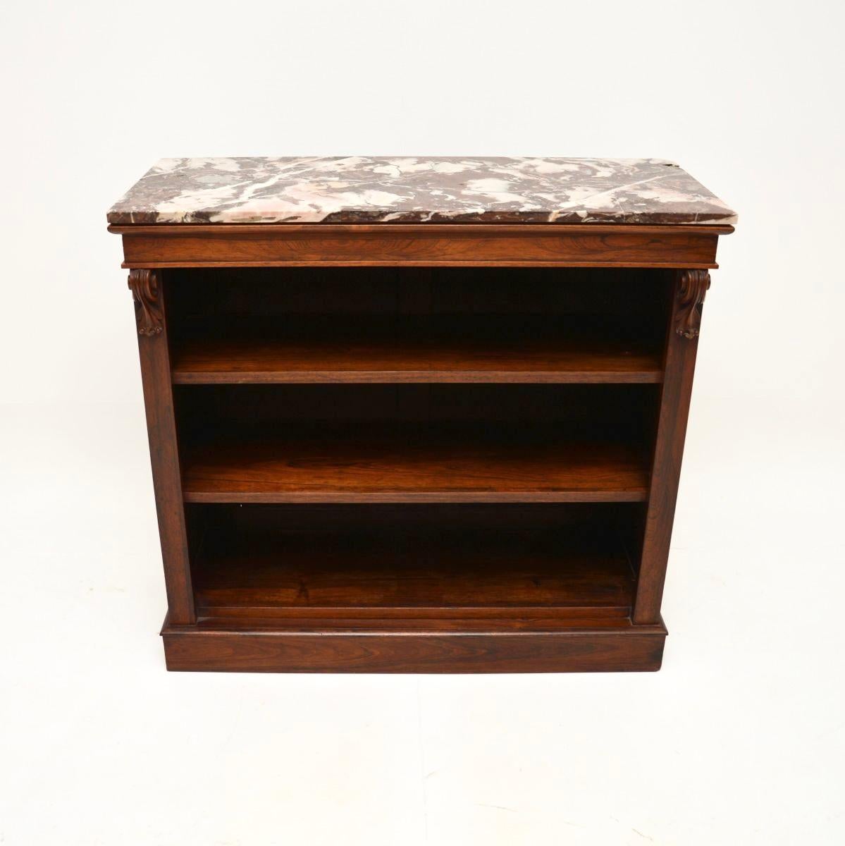 A beautiful antique Victorian marble top bookcase, made in England and dating from around the 1840-1860 period.

It is of fantastic quality and is a useful size. The wood has a gorgeous colour tone and stunning grain patterns, there is a wonderful