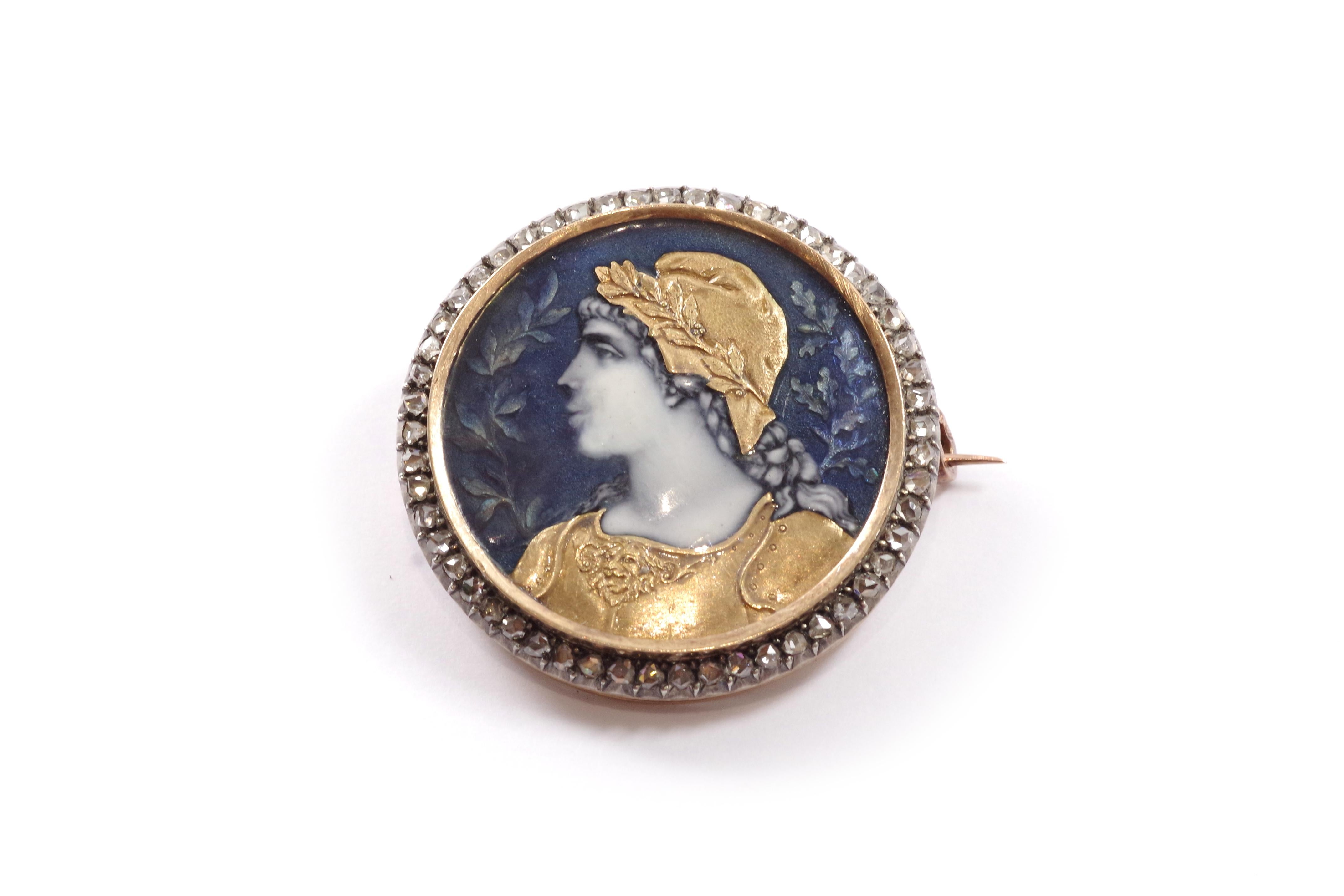 Antique Victorian Marianne brooch in 18 karat rose gold and silver. Antique brooch decorated with an enamelled portrait Marianne (French symbol) wearing a Phrygian cap topped with a laurel wreath. The portrait is set off by a surround of rose-cut