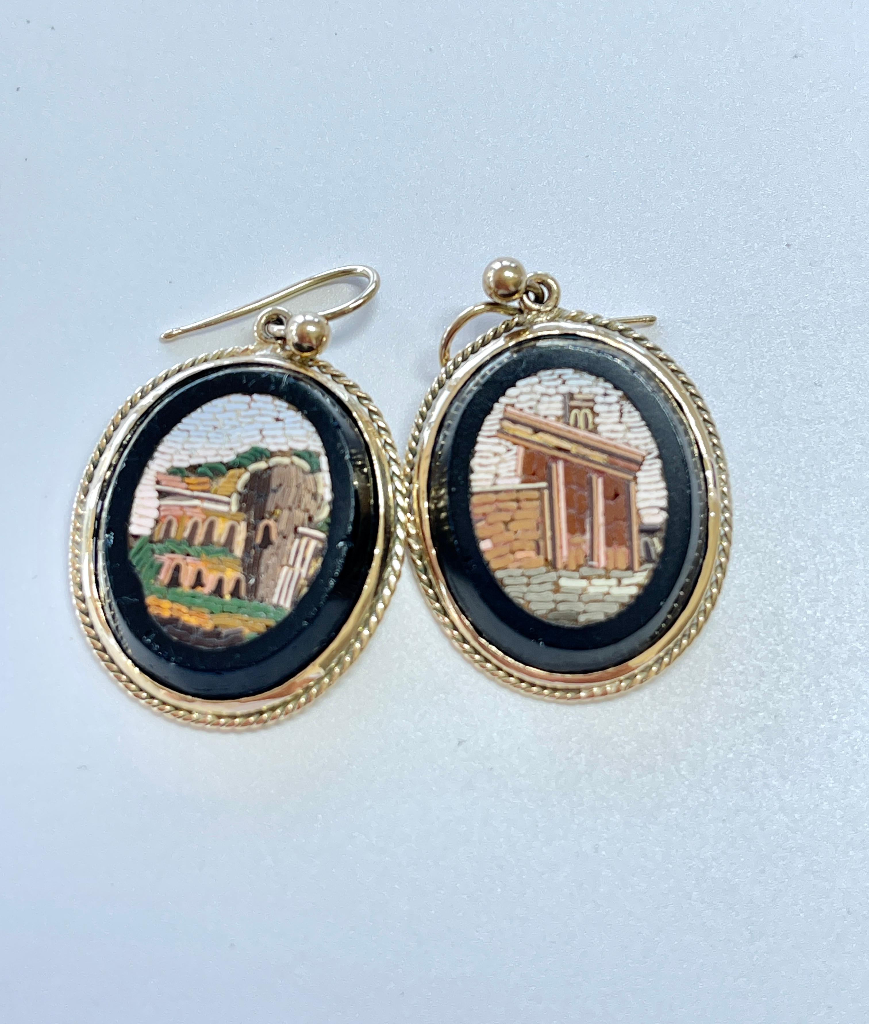 We are thrilled to offer you some high quality, Micro Mosaic pieces!
These stunning earrings feature scenes of Roman ruins created by micro pieces of coloured glass.  Each piece is meticulously cut and then hand inlayed into black glass.  This is