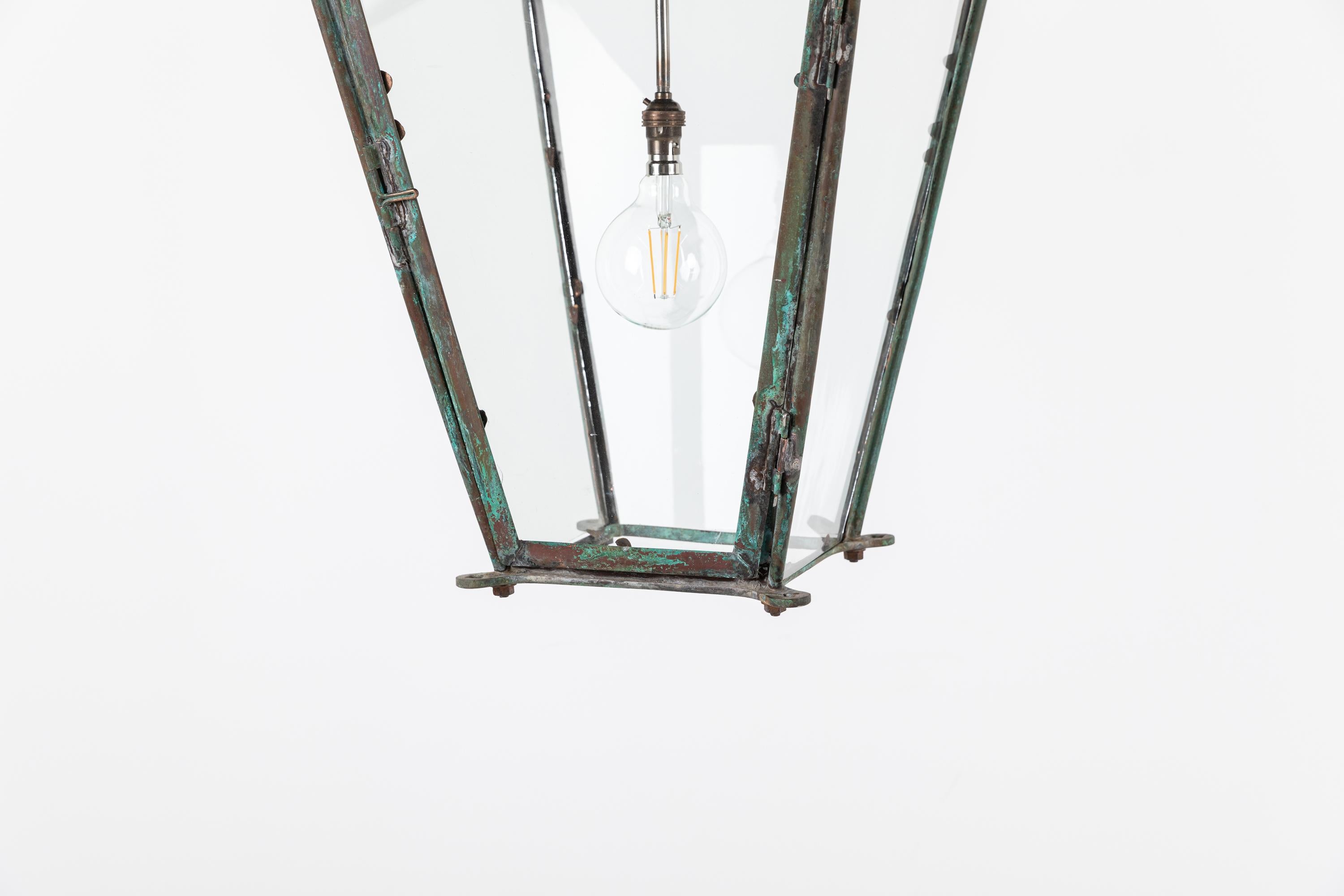 Copper street lantern with natural verdigris made in England. c.1860.

Dating to the mid-late 19th Century with a beautiful natural verdigris patina and original rolled glass. Small, descreet adaption allowing the lantern to be hung from a