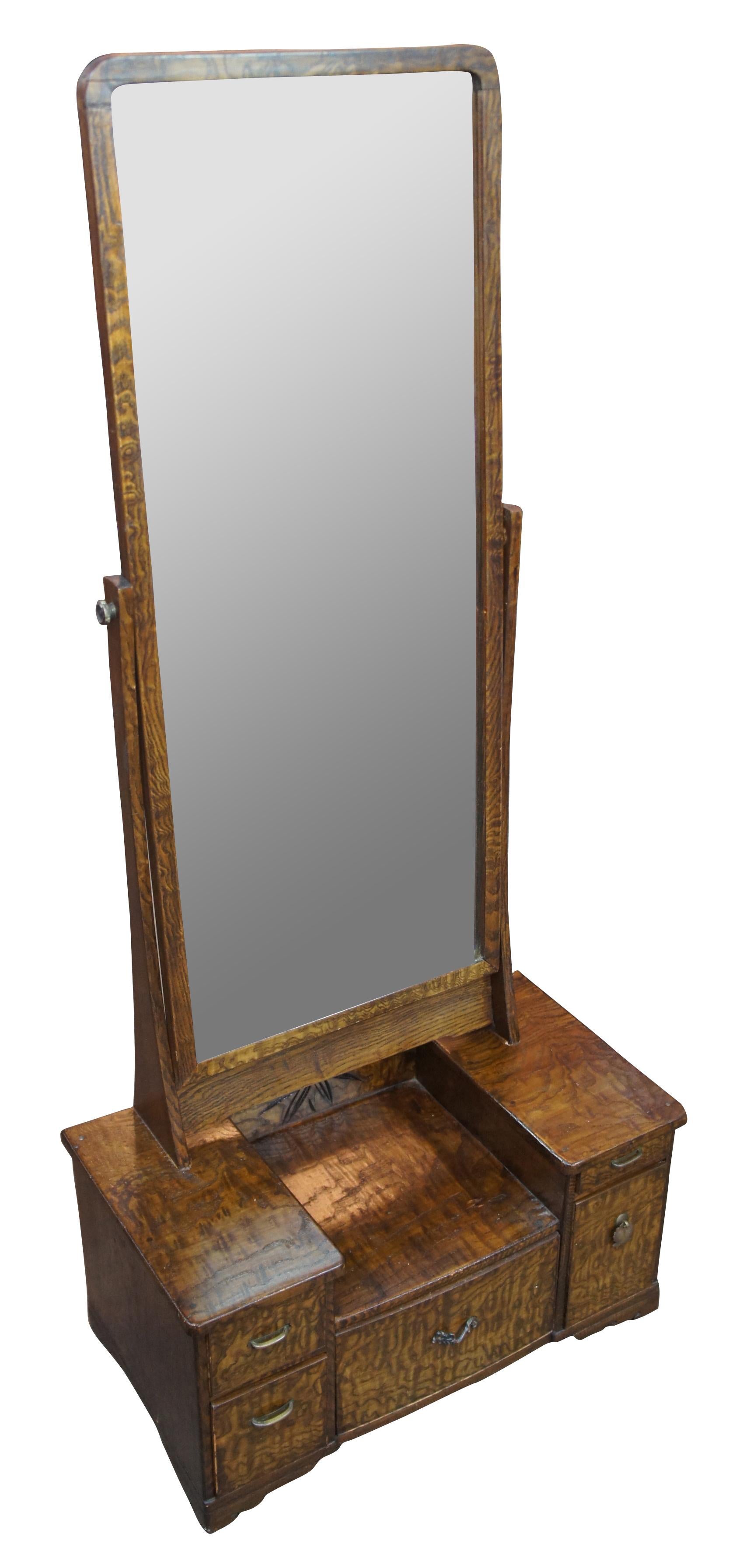 Antique late Meiji Period Japanese Tansu Kyodai or Sanmenkyo. The squat base with drawers is meant to hold cosmetics; coupled with a disproportionately long mirror, the piece is designed to placed on the floor to apply makeup and to style hair while