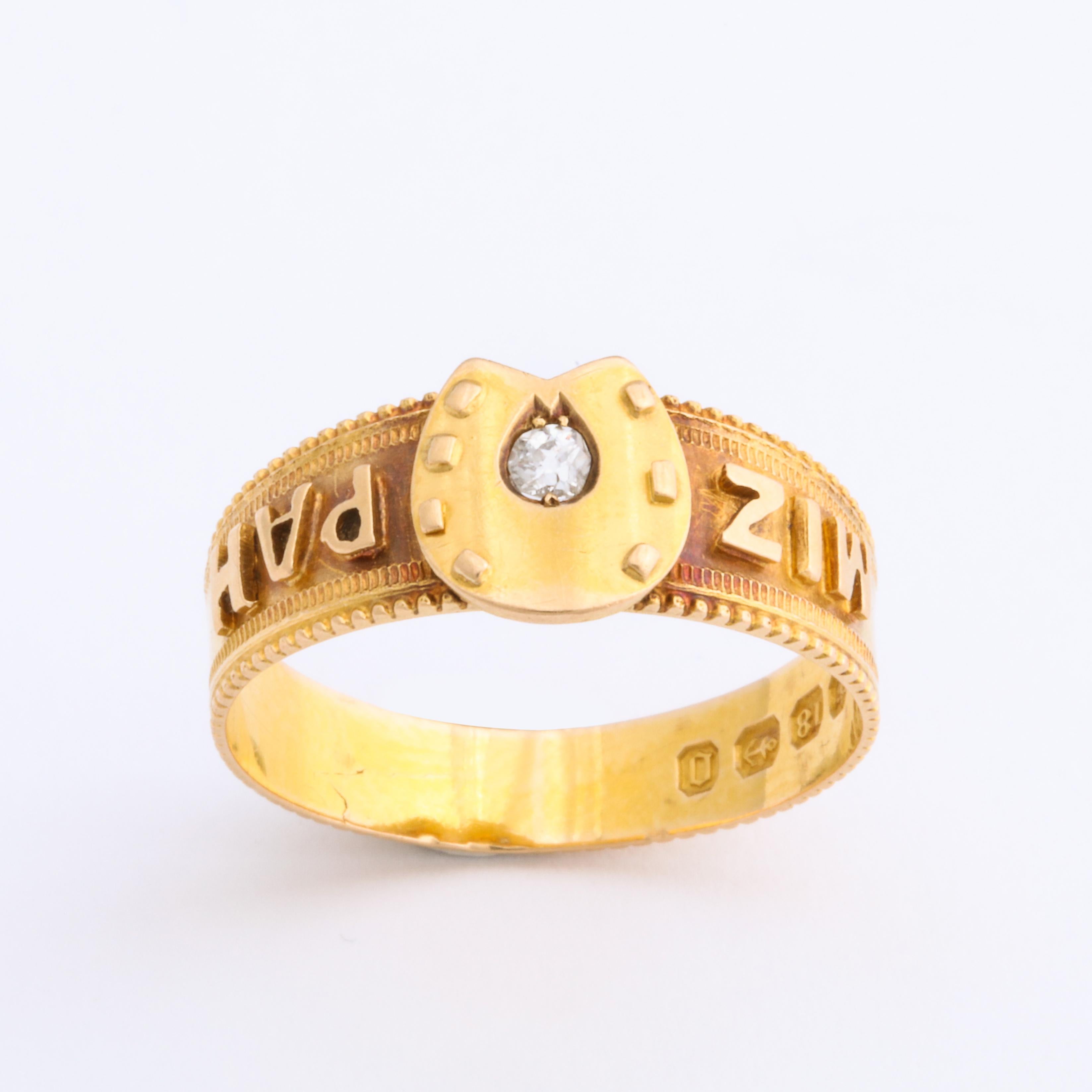 A distinctive 18 Kt Mizpah ring brings double luck, one with its blessing and the second with its central horseshoe that is graced by an old mine diamond at the center and set in a horseshoe shape. The diamond is .07 cts and twinkles like the north