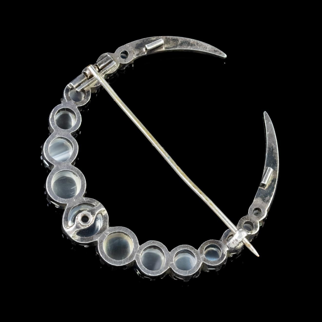 A fabulous late Victorian Silver crescent moon brooch claw set with beautiful Moonstones which graduate in size from a 2.3ct down to a 0.10ct stone. 

Crescent moons were a symbol of the feminine moon goddess and represented change and female