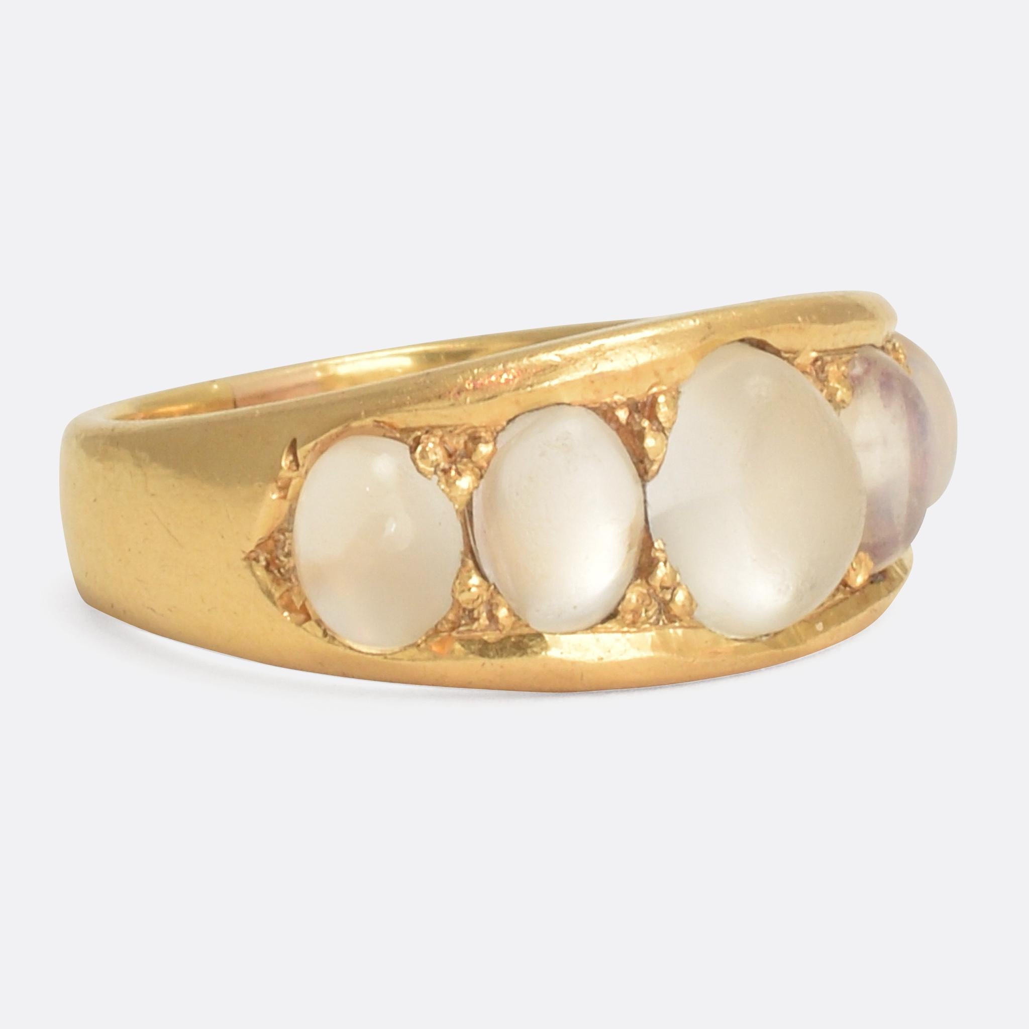 A fine 18k gold gypsy ring set with five graduated moonstones. It has a good substantial feel, and is particularly well made. Dating from the late Victorian era, circa 1890; the moonstone display excellent adularescence - the effect whereby light
