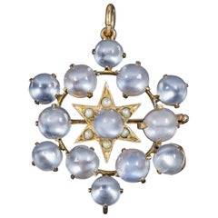 Antique Victorian Moonstone Pearl Star Pendant Brooch 18 Carat Gold, circa 1880