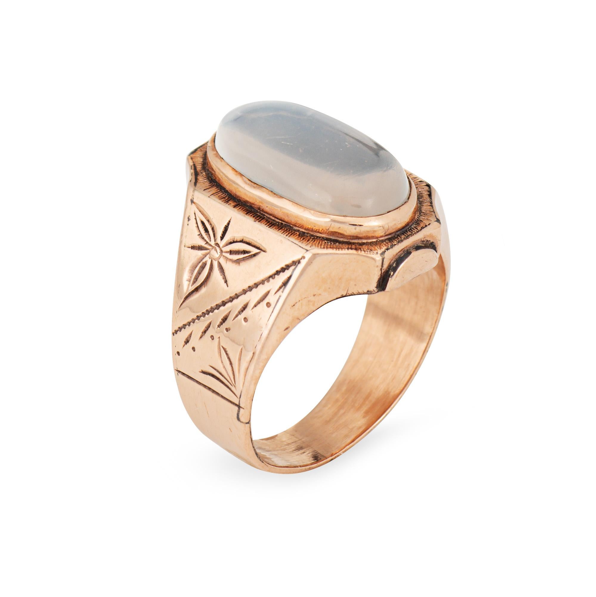 Stylish antique Victorian era moonstone ring (circa 1880s to 1900s), crafted in 10 karat rose gold.

Cabochon cut moonstone measures 15mm x 8mm. Note: light surface abrasions visible under a 10x loupe.

Glowing with a soft rainbow blue-silver light,