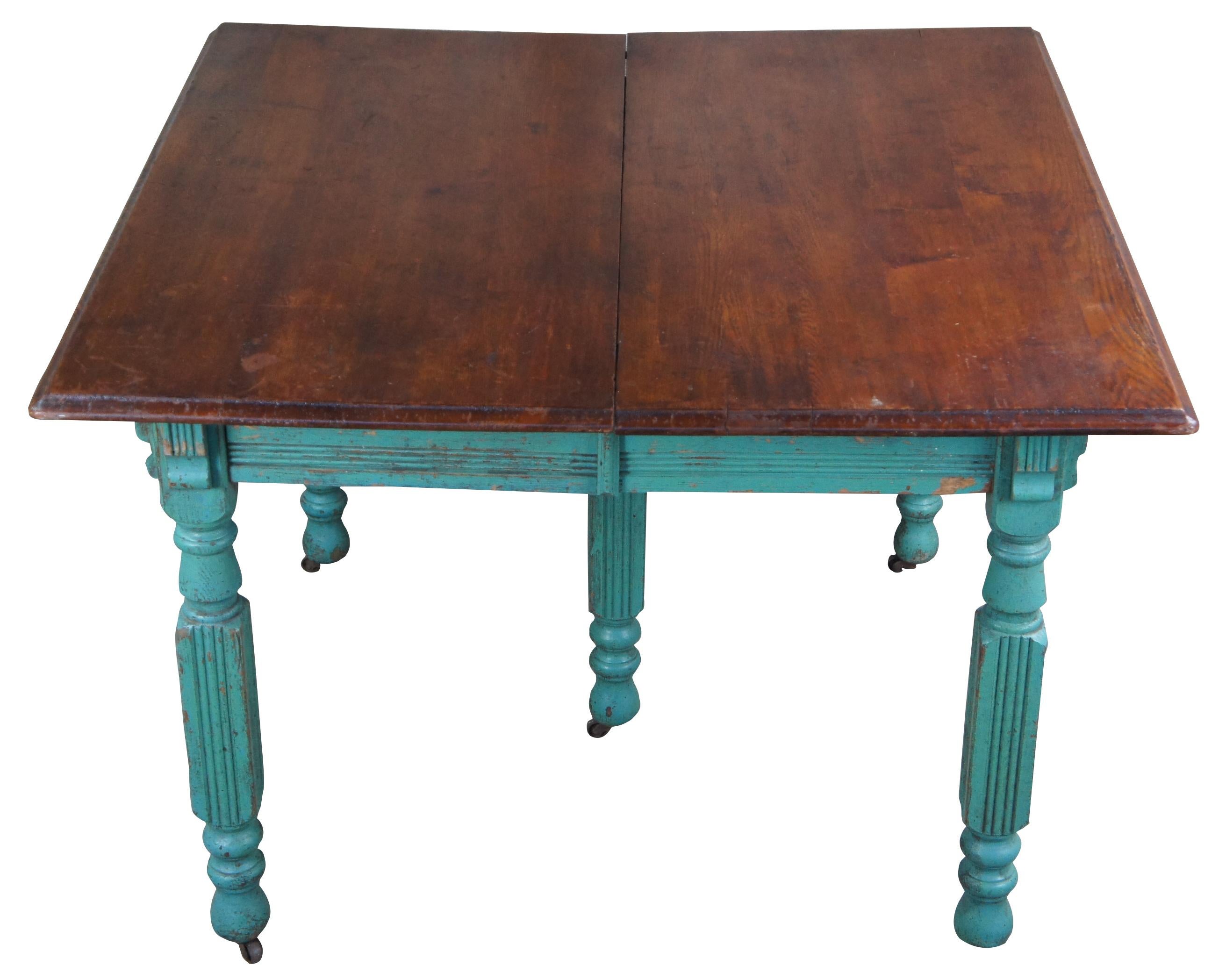 Antique Mormon Pioneer dining or breakfast table featuring aqua blue green boho painted base and extendable top. One 11