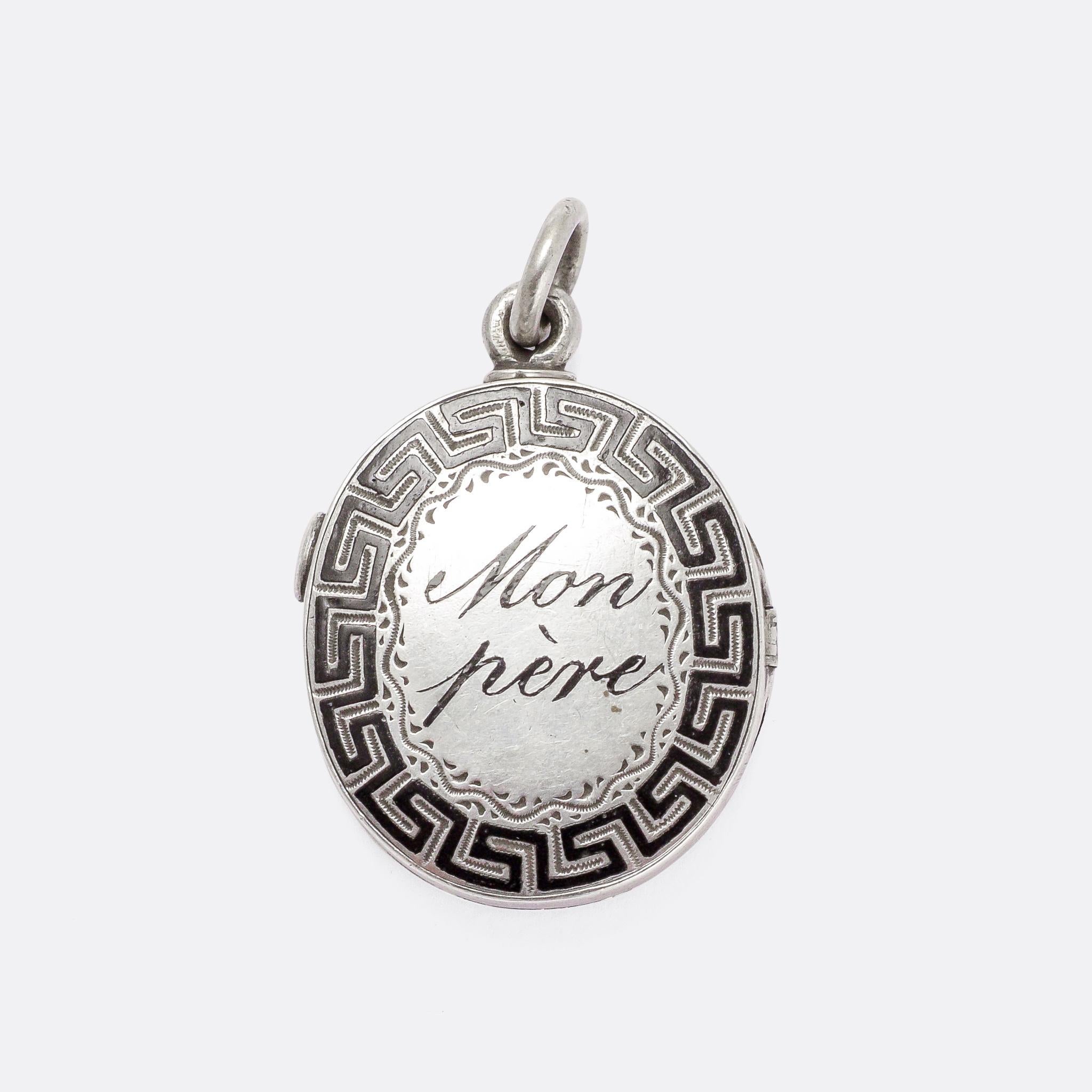 Such a cool antique locket dating from the mid Victorian era, circa 1870. It features a Greek key border around the words Ma Mère [my mother] on one side, and Mon Père [my father] on the other. It opens to reveal two oval locket compartments