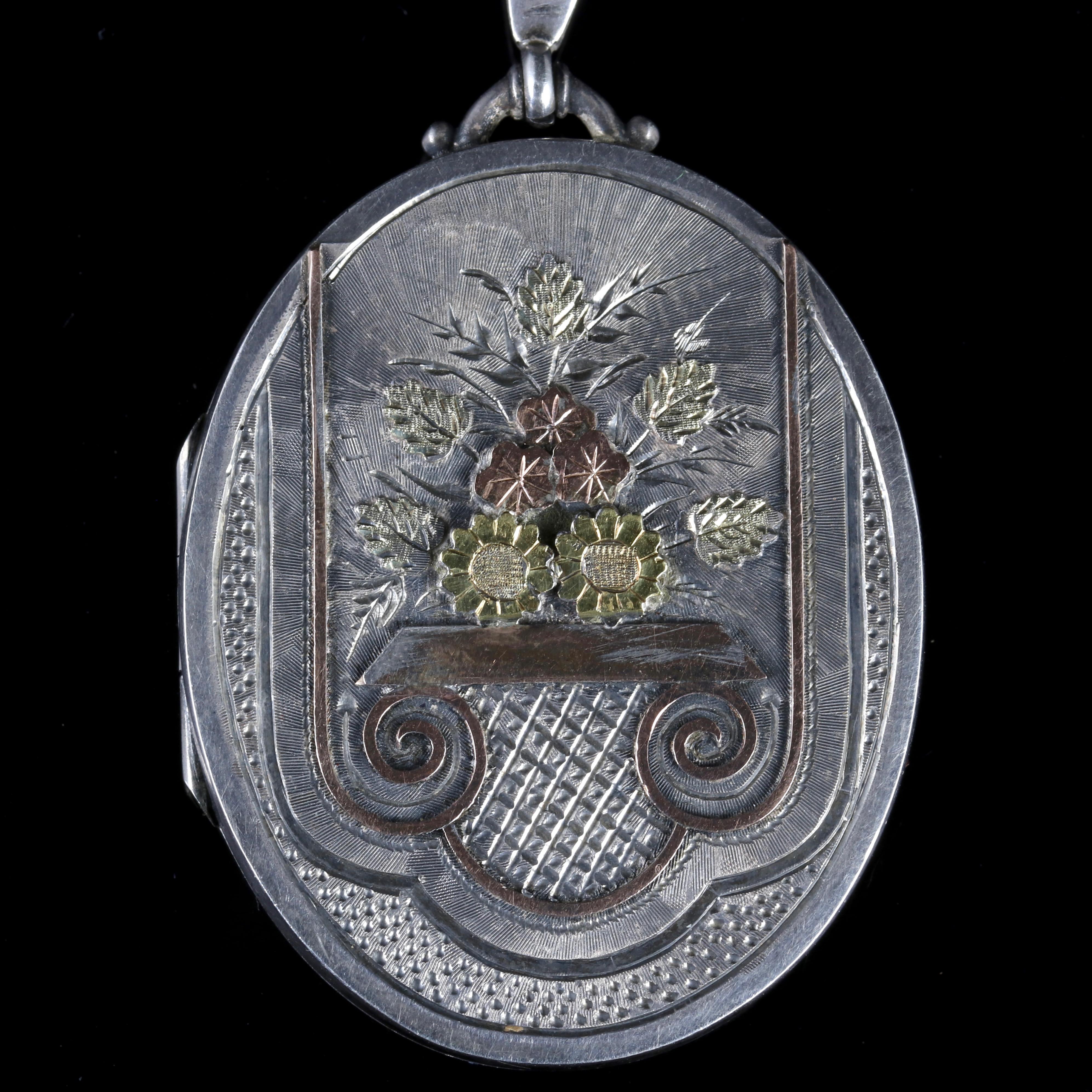 This beautiful Sterling Silver Victorian locket is dated Birmingham 1882.

The locket displays beautifully engraved Motifs set in 18ct Yellow Gold.

The locket opens and shuts securely.

Full hallmarked Birmingham 1882 makers initials are W & Co,