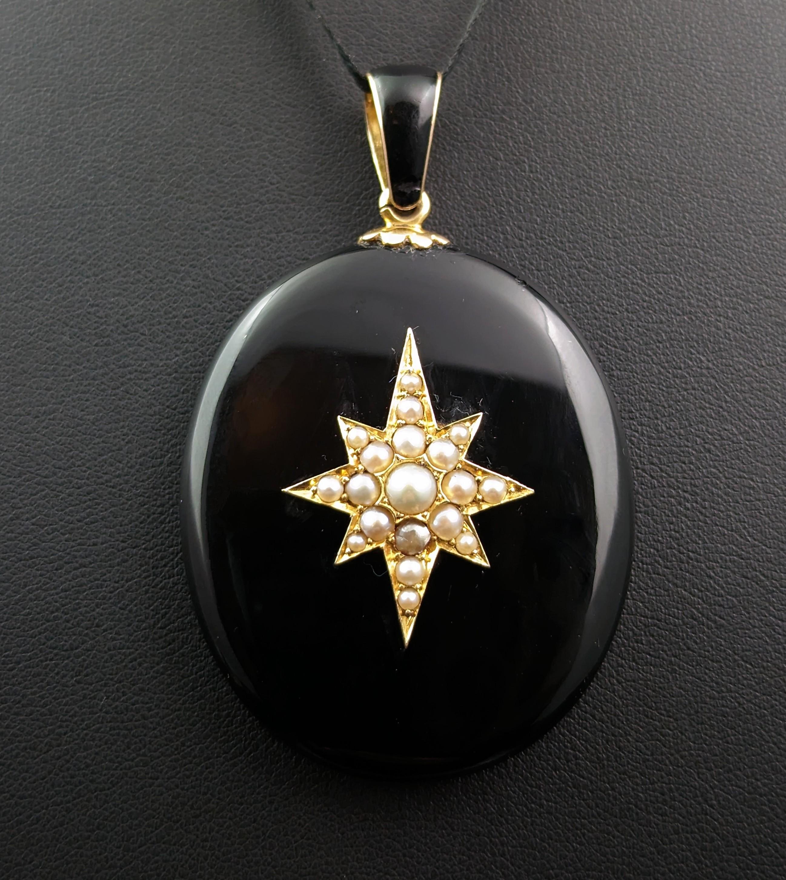You will be enamored by this stunning antique, Victorian era mourning locket pendant.

Smooth highly polished rich and inky black Whitby Jet with a beautiful central gold star motif that is set with rich creamy pearls, giving it a special celestial