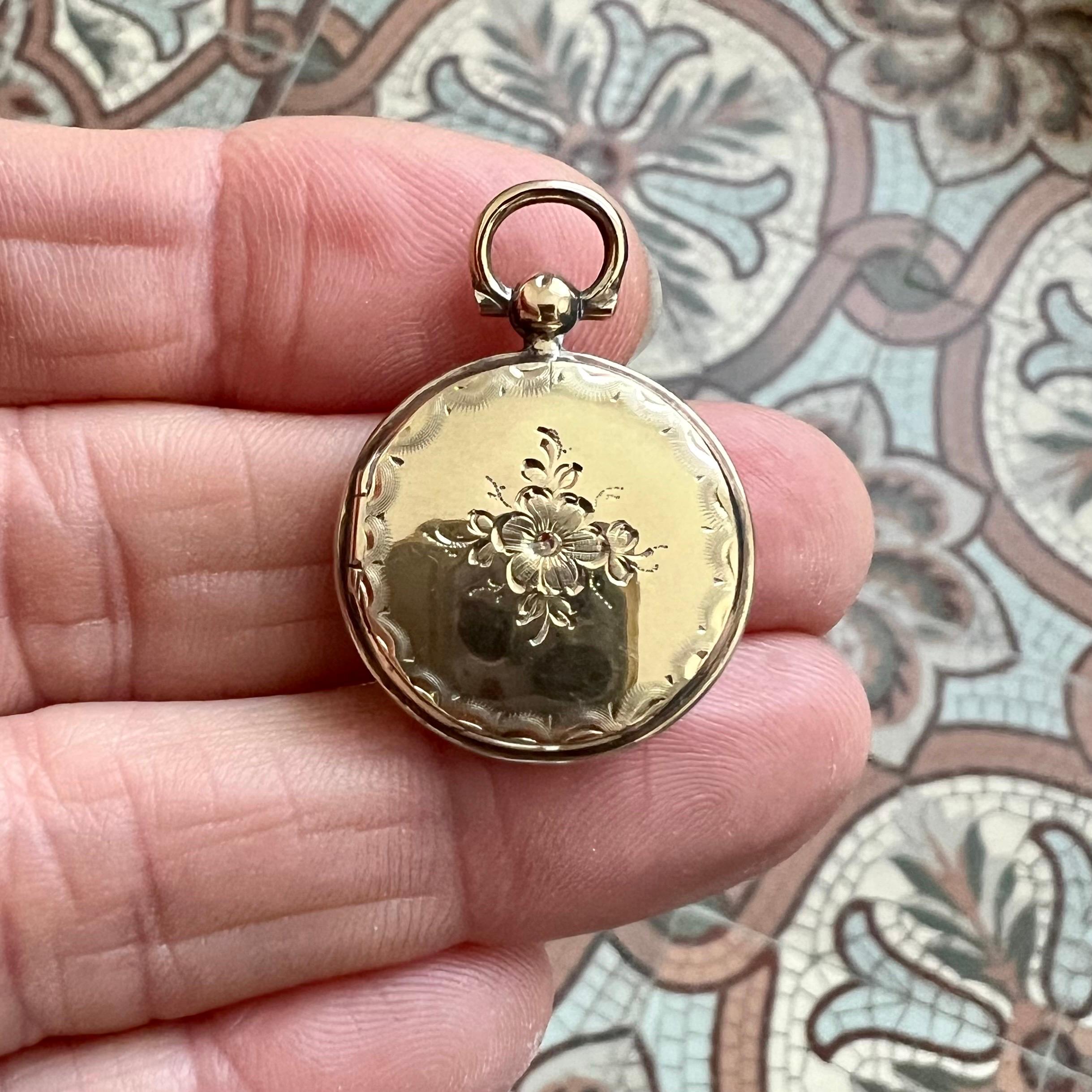 This exquisite antique Victorian mourning locket, crafted in 14 karat gold, is a beautifully preserved example of 19th-century sentimental jewelry. Designed to hold a keepsake of a loved one, it features an intricately braided lock of hair encased