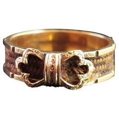 Antique Victorian Mourning Ring, 15 Karat Yellow Gold, Hairwork, Bow Front