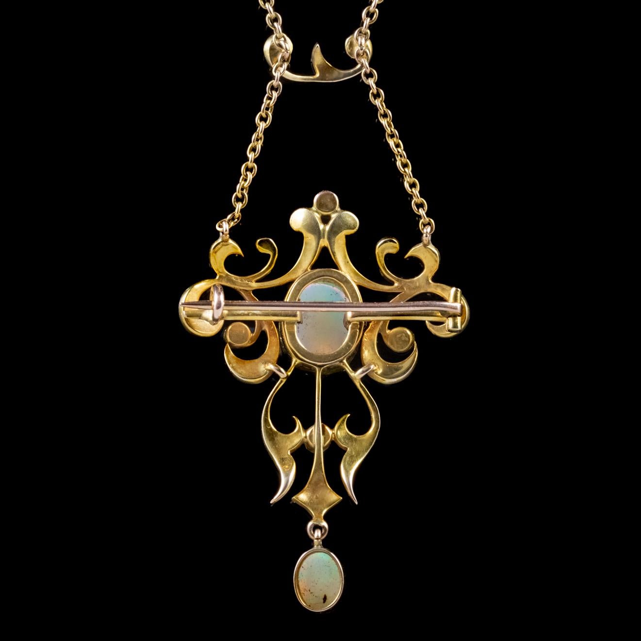 This spectacular antique Victorian opal and pearl pendant is built around a beautiful approx. 3ct natural Opal, surrounded by loops and swirls delicately crafted in 18ct Yellow Gold and studded with Pearls. 

A decorative bar, also adorned with