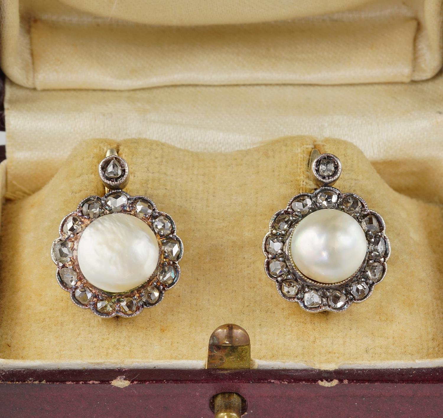 1870 ca!

Rare and marvellous pair of original Victorian Natural Pearl and Diamond earrings.
Classy design of the period skilfully hand crafted of solid 16 Kt gold and silver portions - not marked
Boasting two Natural not nucleated sea Pearls from