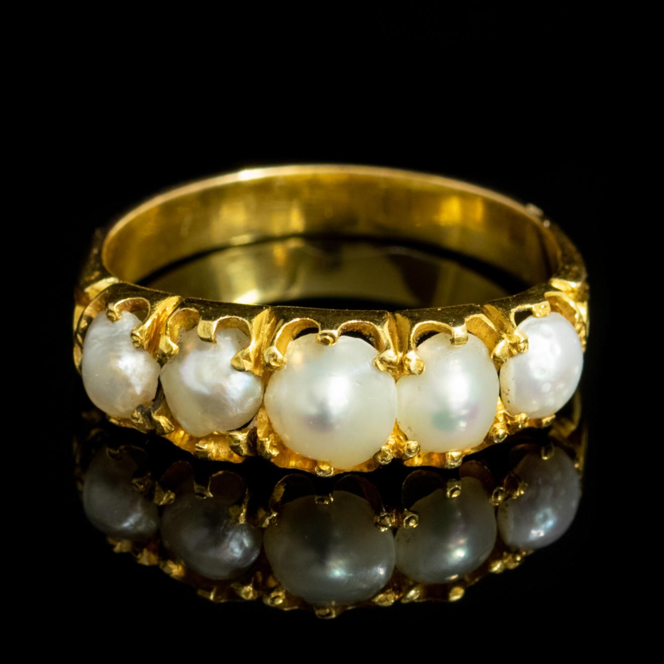 This gorgeous Victorian ring, produced around 1860, features five beautiful Natural Pearls set in the face of an 18ct Yellow Gold gallery.

Pearls are a true gift from Mother Nature and symbolise purity, innocence and beauty, which is why they have