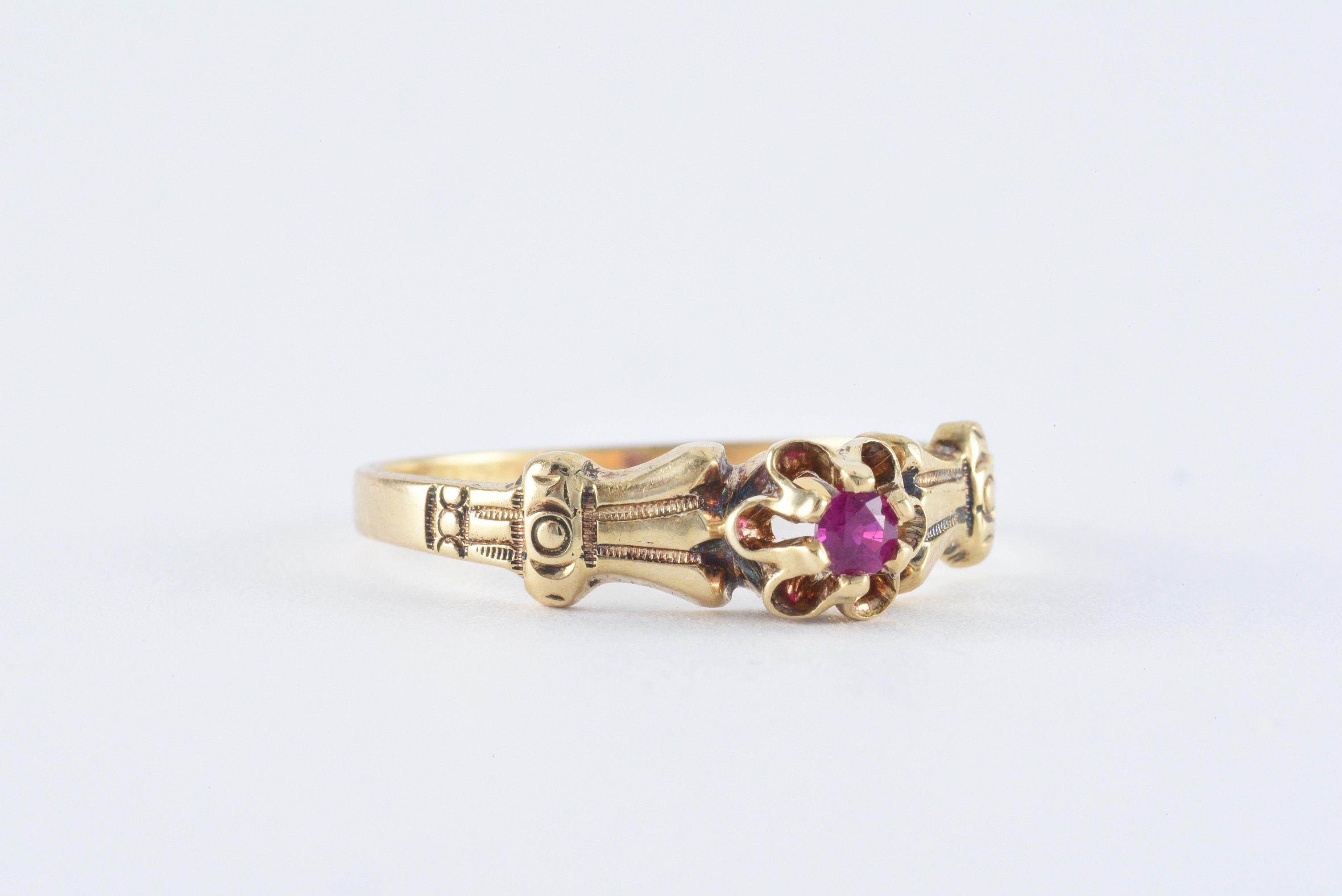 This delicate antique Victorian band is designed around a natural round red ruby in a crown setting and fashioned from 14kt yellow gold with hand engraved details. 
