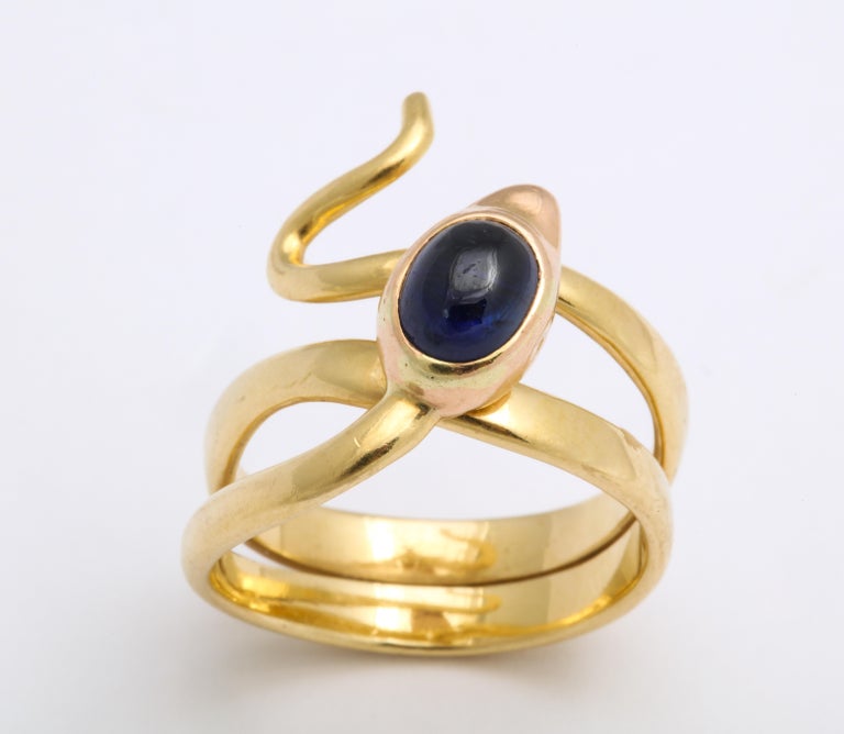 Three coils of 18 Kt gold, a wiggly extending tail that rests comfortably just above the knuckle, an oval sapphire of 1.25 cts and the finest workmanship of any serpent ring I have seen, is available for purchase. The eyes are mini diamond specks,
