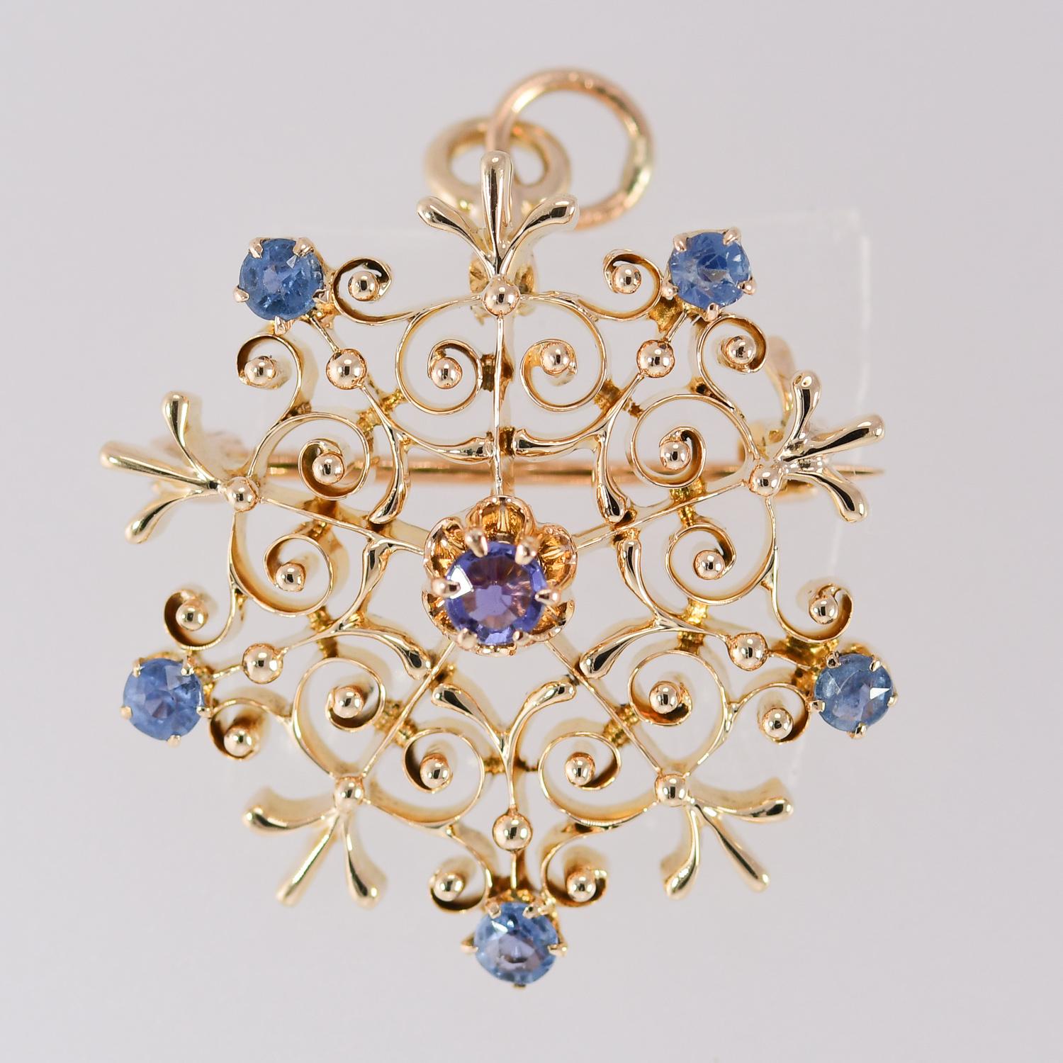 Antique Victorian Natural Sapphire Starburst Brooch/Pendant 14K Yellow Gold With Natural Blue Sapphires. The Six Bright Round Ceylon Blue Sapphires Measure from 2 1/2 to 3 millimeters. There is a Locking Bar Pin and Swivel Bail on the Reverse Side.