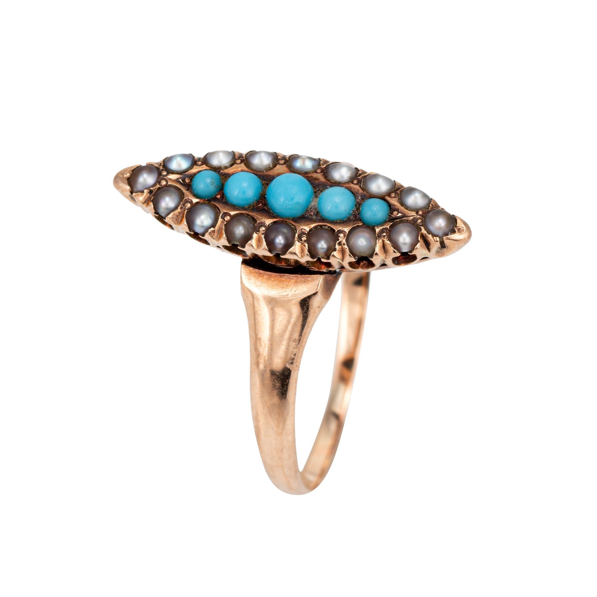 Stylish antique Victorian era navette ring (circa 1880s to 1900s), crafted in 10 karat yellow gold.

Cabochon cut turquoise measures from 1mm to 2mm. Small seed pearls accent the turquoise and measure approx. 1mm each. The turquoise is in very good