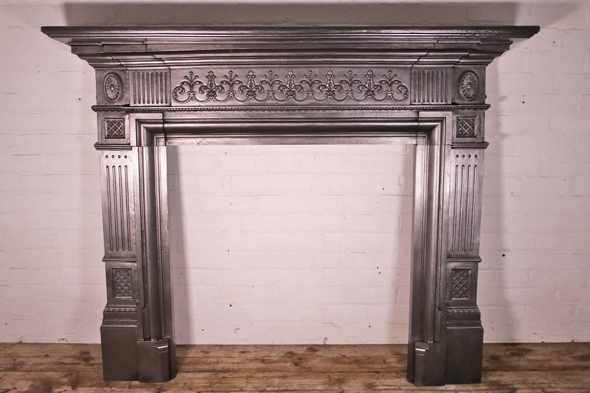 Antique Victorian cast iron fireplace surround in the neoclassical manner, circa 1885.

Finished with traditional black grate polish. leaving a gun metal / pewter shine. 

 
