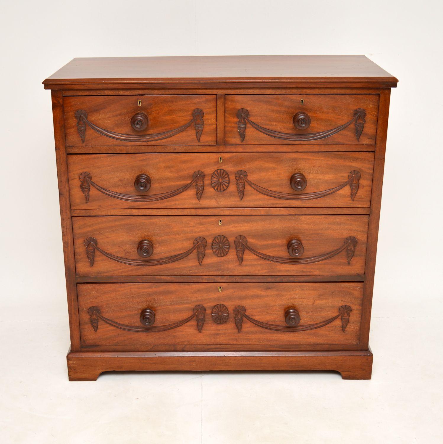 A stunning antique chest of drawers in wood. This was made in England, it dates from around 1890’s period.

The carving on the drawers fronts is spectacular. The overall design is beautiful and the carving accentuates the straight lined design