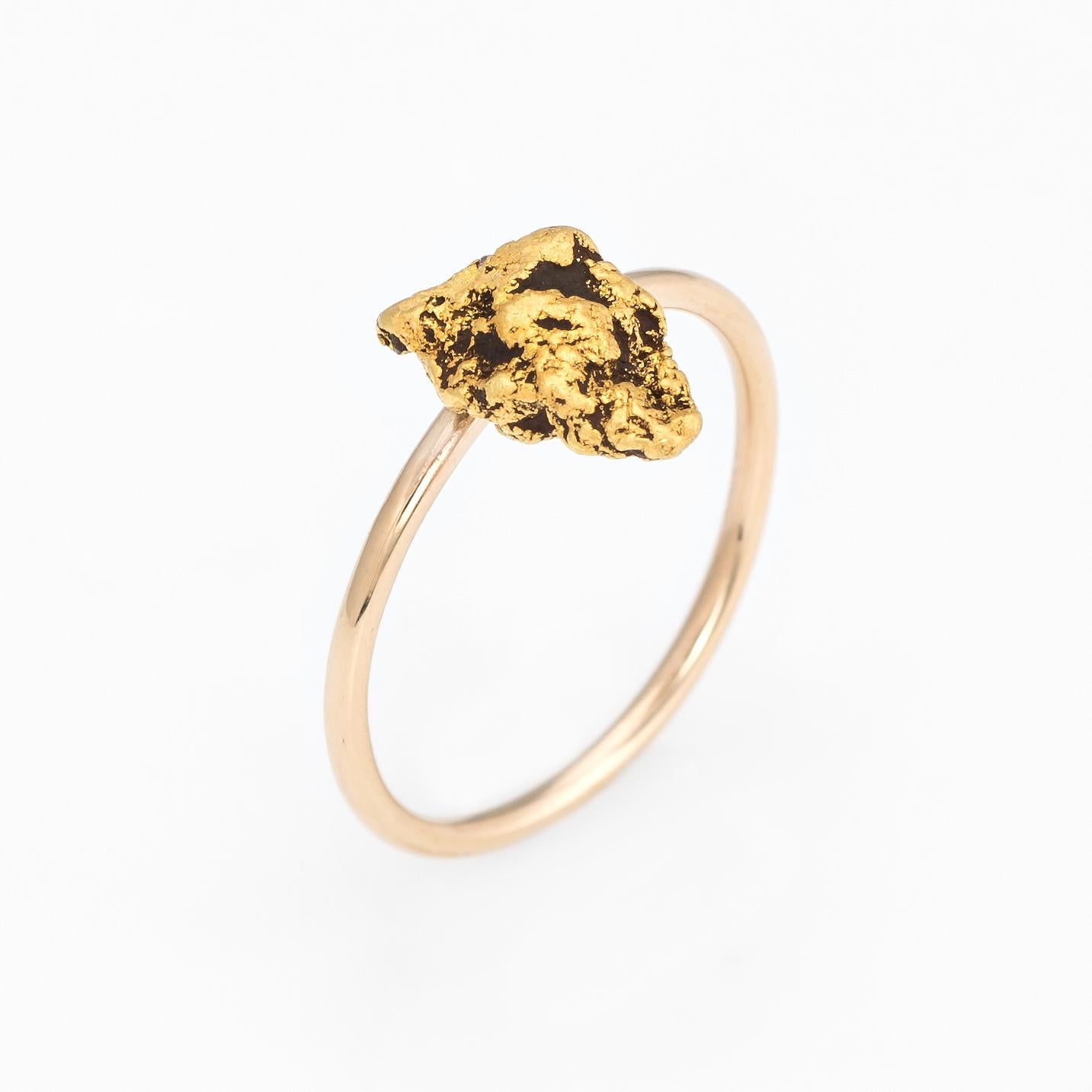Originally an antique Victorian era stick pin (circa 1880s to 1900s), the nugget ring is crafted in 14 karat yellow gold. 

The ring is mounted with the original stick pin. Our jeweler rounded the stick pin into a slim band for the finger. The