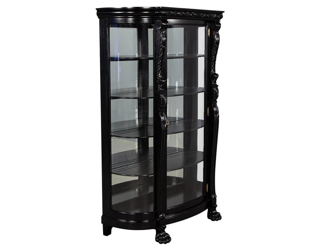 Antique Victorian oak curve glass display Curio China cabinet. Black oak antique Victorian carved display china cabinet finished in a hand polished satin ebonized lacquer.

Price includes complimentary scheduled curb side delivery service to the