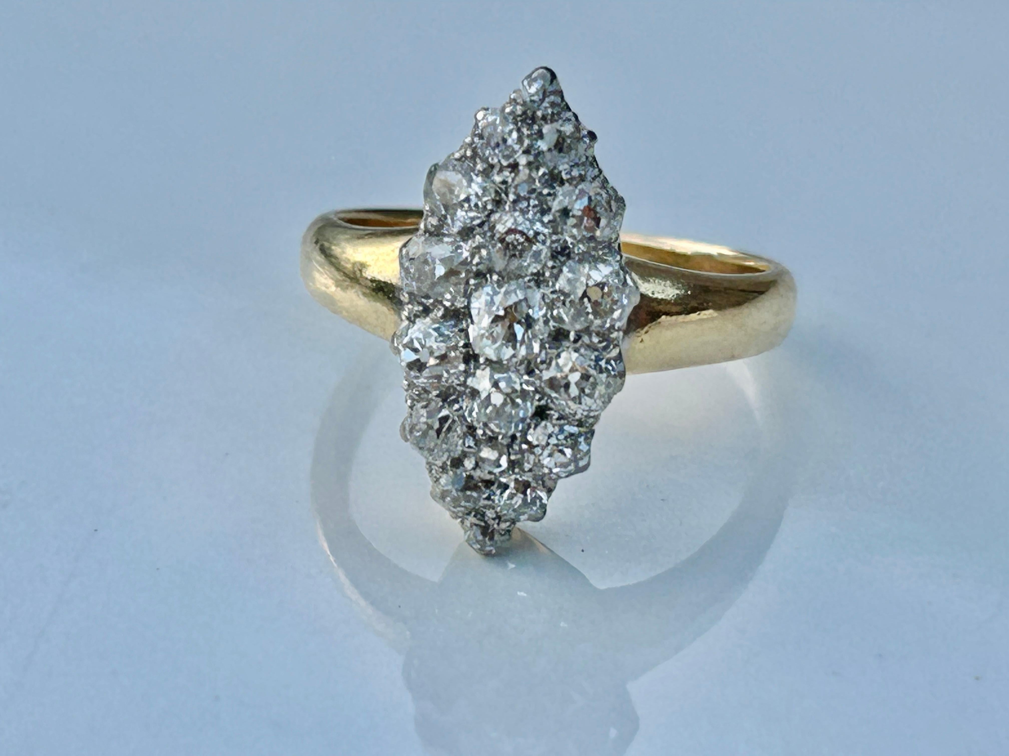 Stunning Nineteen (19) Old Mine Cut Diamonds clustered in a breathtaking Antique Victorian Navette ring. 
The ring is set with approximately 1.51 carats of Old Mine Cut Diamonds of SI1 - Si2 clarity, G-H Color.  These stones are tightly compact and