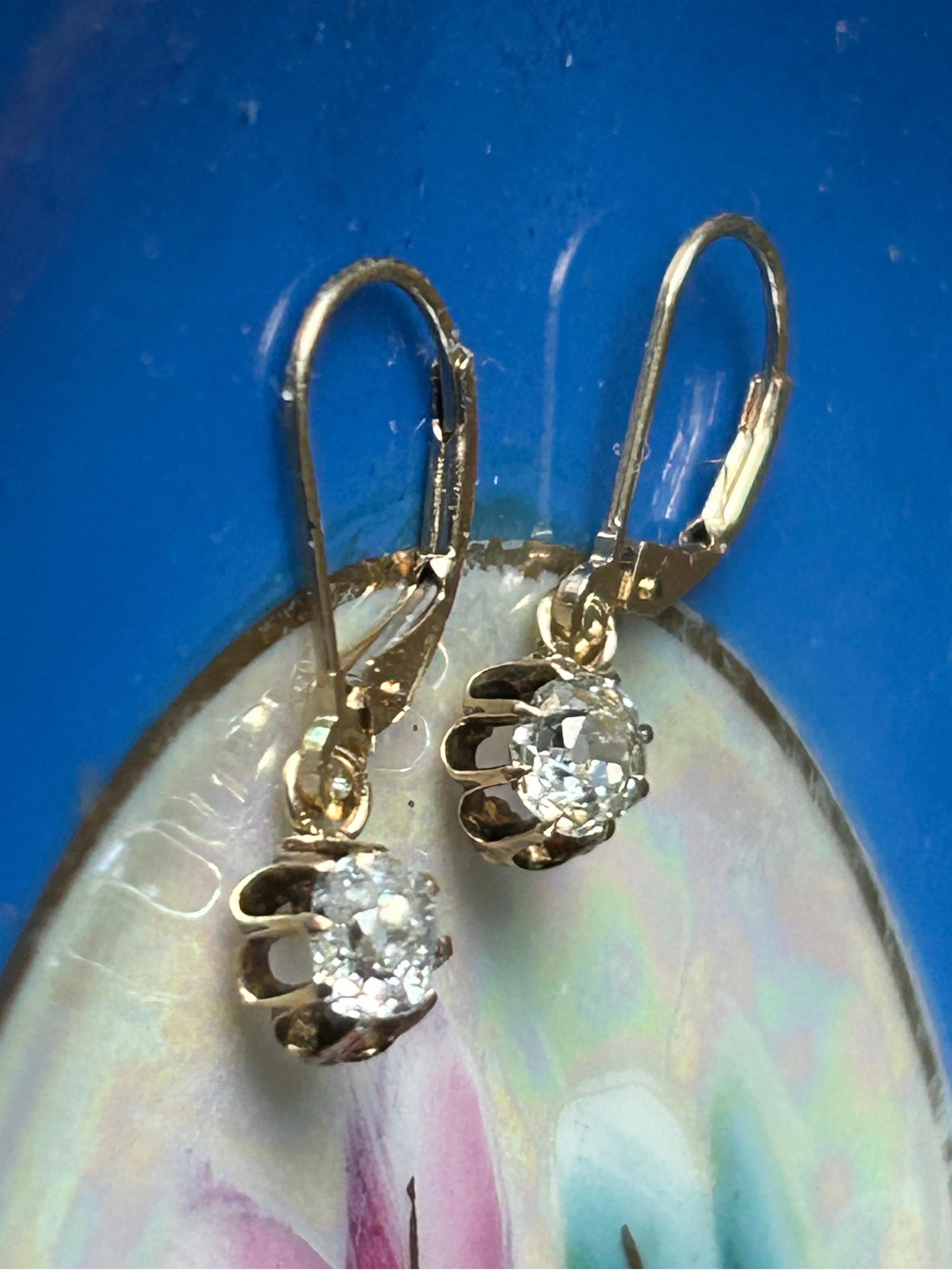 Antique Victorian Dangle Old Mine Cut Diamond Earrings with new lever back.
.60 diamond ctw.
CIRCA 1890
The old mine cut diamonds in raised claw settings, approximately 0.60 carats total
The diamonds are bright and lively, one is a slightly tinted