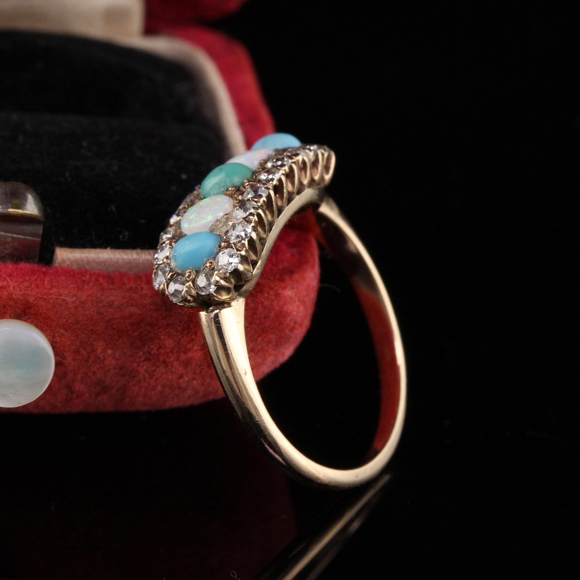 Stunning antique victorian ring with old mine cut diamonds, opal and turquoise. 

Item #R0521

Metal: 14K Yellow Gold

Weight: 3.1 Grams

Total Diamond Weight: Approximately 0.65 cts

Diamond Color: H

Diamond Clarity: VS2

Ring Size: 6.5

This ring