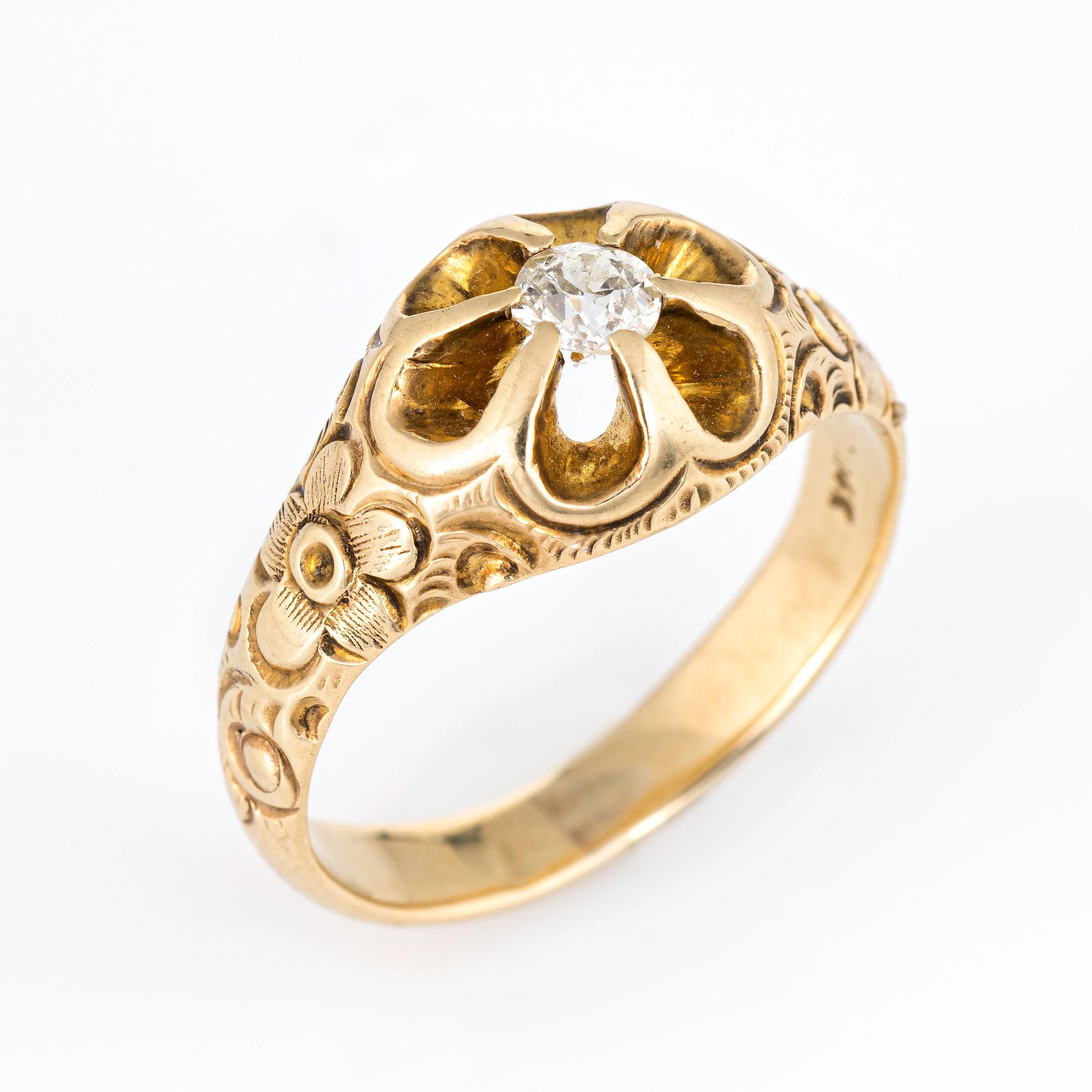 Finely detailed antique Victorian era ring (circa 1880s to 1900s) crafted in 14k yellow gold. 

One old mine cut diamonds are estimated at 0.25 carats (estimated at H-I color and SI1-2 clarity). 

The side shoulders feature chased floral detail