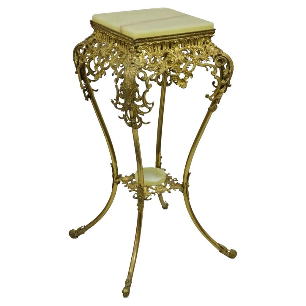 Mesa auxiliar antigua victoriana de ónice, latón dorado y ornamentada con pie para plantas
