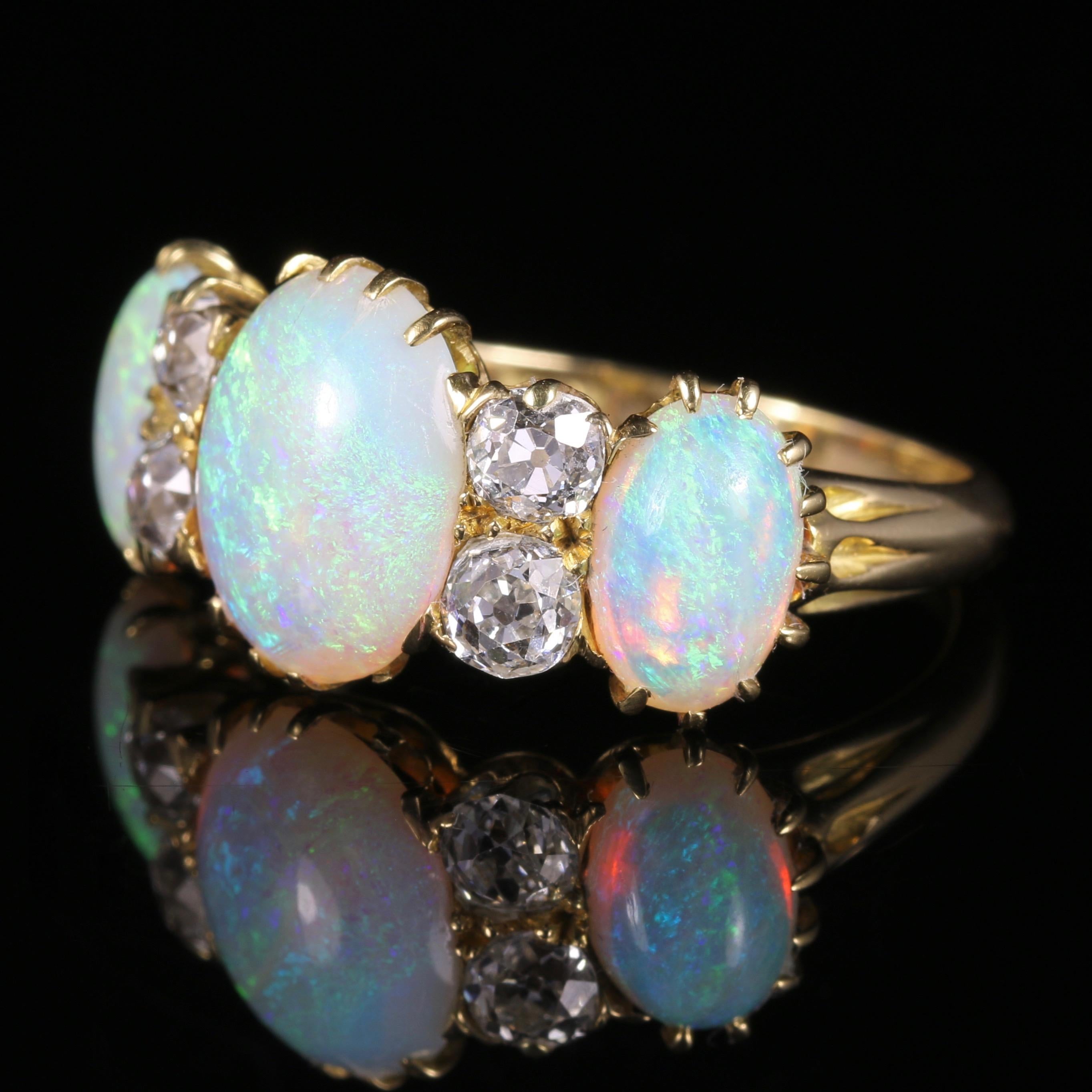 For more details please click continue reading down below...

This is a spectacular antique Victorian natural Opal and old cut Diamond ring, which is Circa 1880.

Set in a lovely 18ct Yellow Gold gallery which is all original.

It is large and