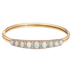 Bracelet jonc victorien ancien en or jaune 14 carats avec opales et diamants