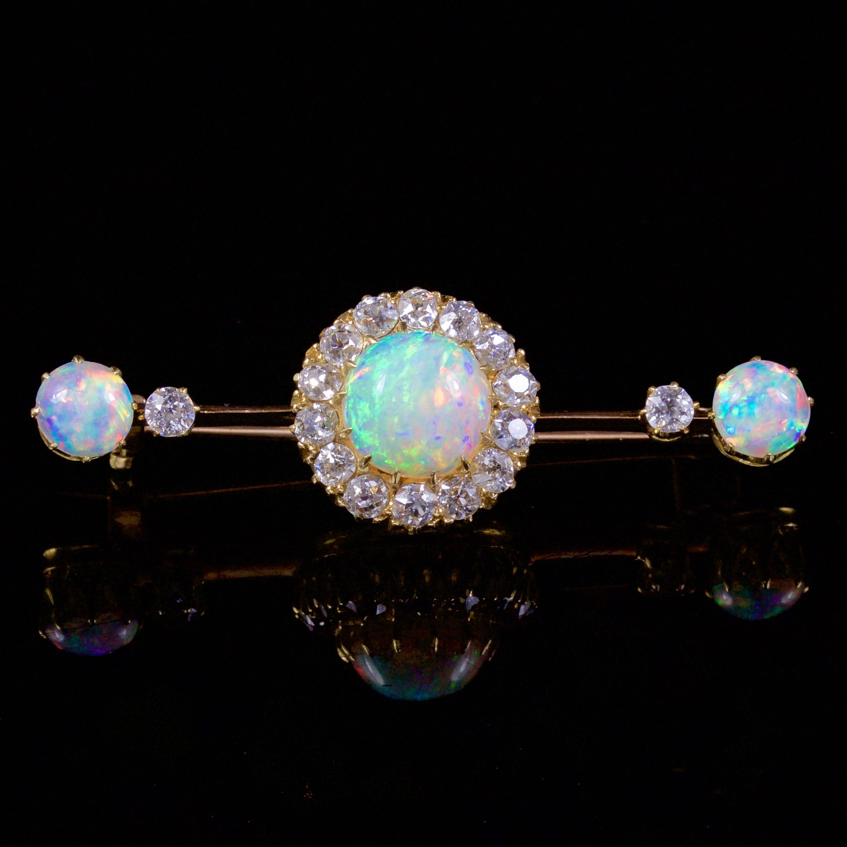 This incredible Victorian 18ct Yellow Gold Opal and Diamond brooch is, Circa 1880.

The brooch is adorned in a large 2ct natural Opal that shows a wonderful hue from within.

The lovely natural Opal is a kaleidoscope of rainbow colours shimmering