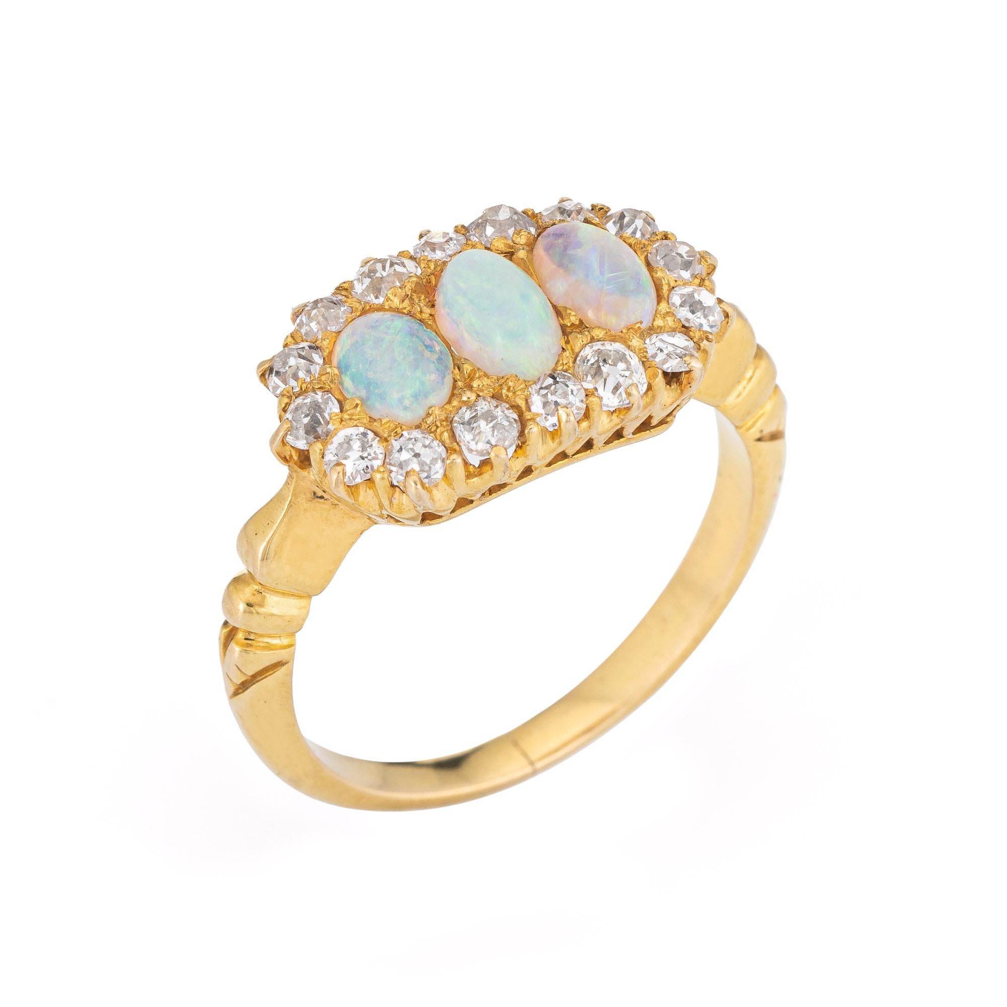 Finely detailed antique Victorian opal & diamond ring (circa 1880s to 1900s), crafted in 18 karat rose gold. 

Three opals measure 5mm x 3mm (estimated at 0.25 carats each - 0.75 carats total estimated weight), accented with 16 estimated 0.05 old