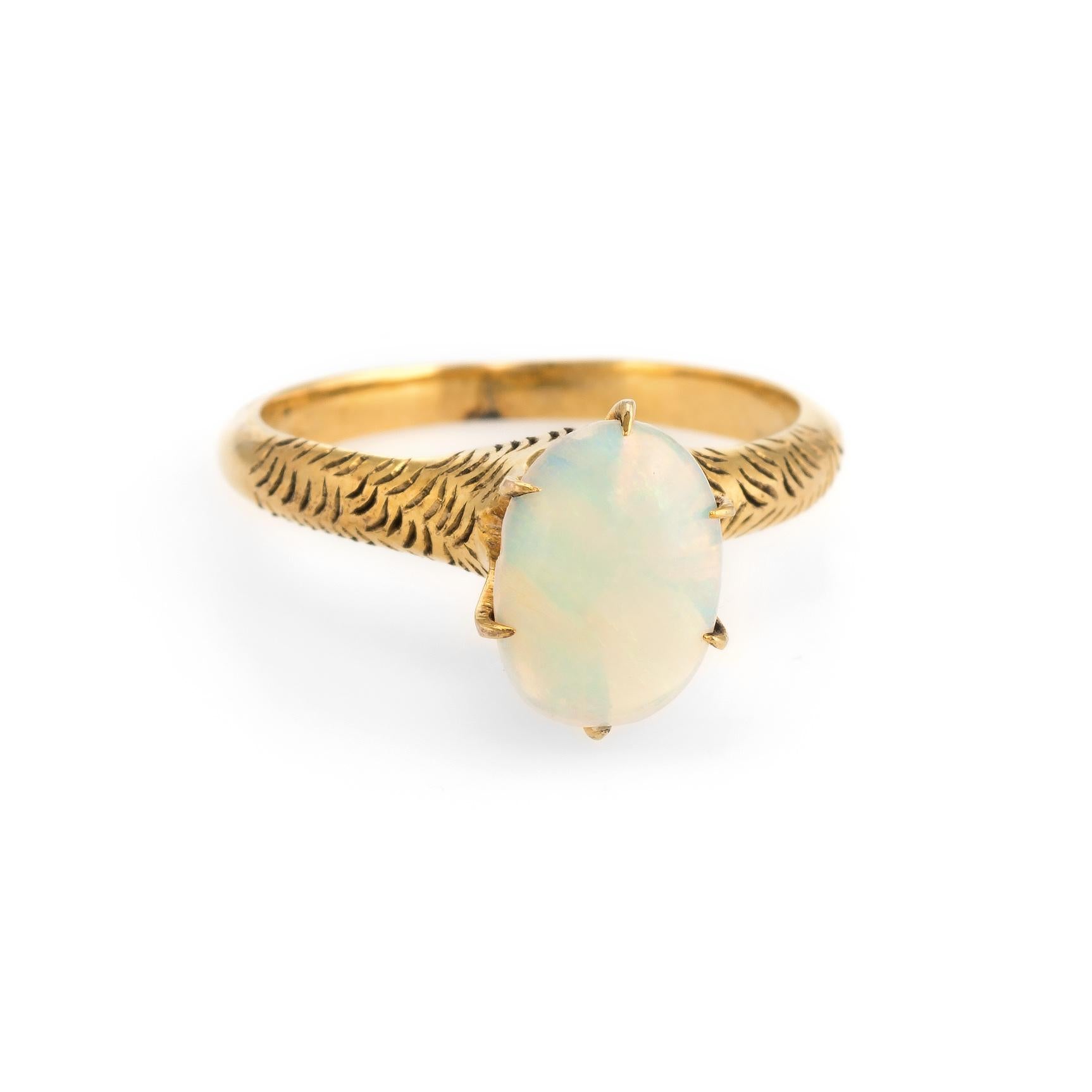 Finely detailed antique Victorian opal ring (circa 1880s to 1900s), crafted in 14 karat yellow gold. 

Natural opal measures 9.5mm x 6mm (estimated at 1.50 carats). The opal is in excellent condition and free of cracks or chips.  

The simple and