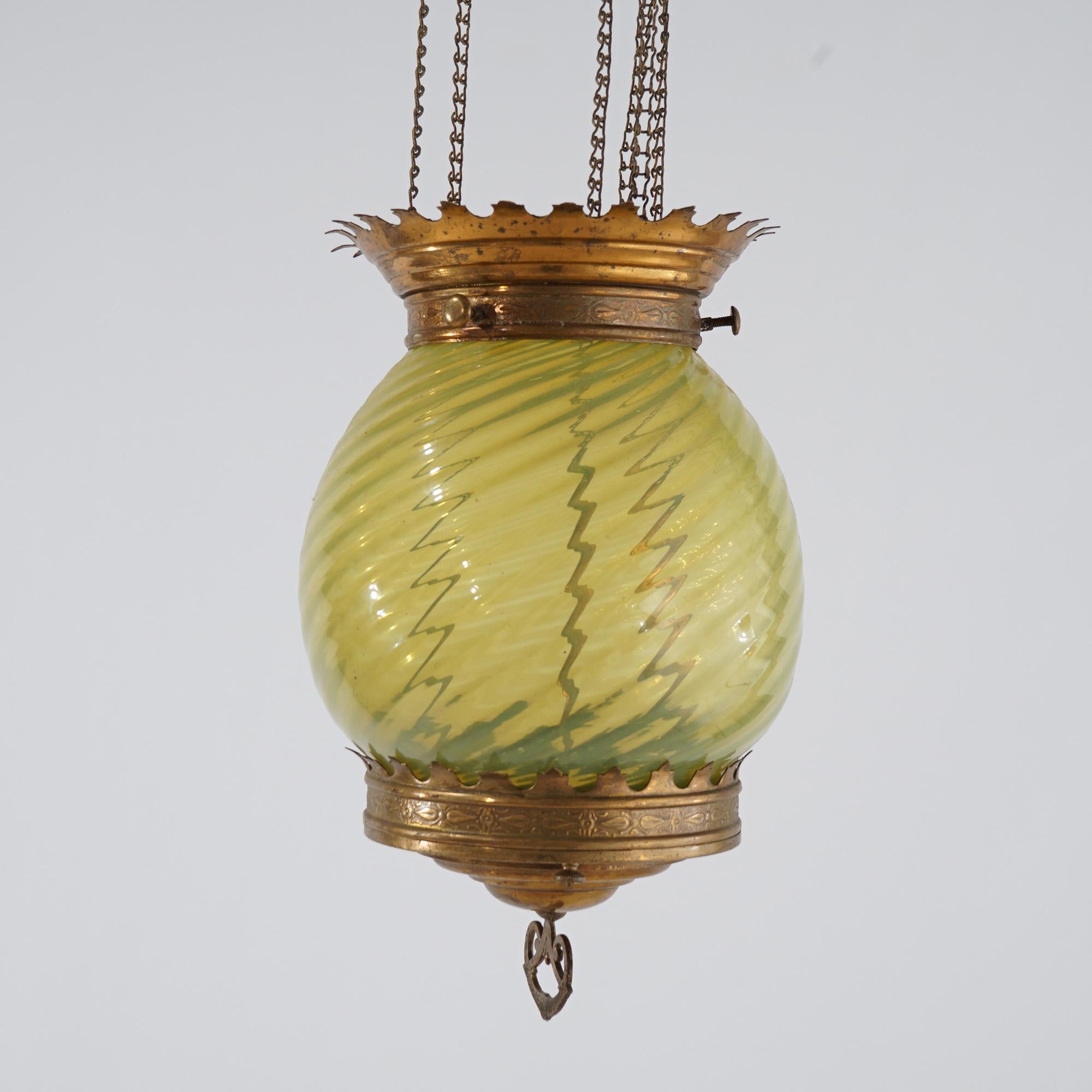 An antique Victorian hanging hall light offers brass frame with opalescent vaseline glass globe, c1880

Measures- 33.5''H x 7.75''W x 7.75''D