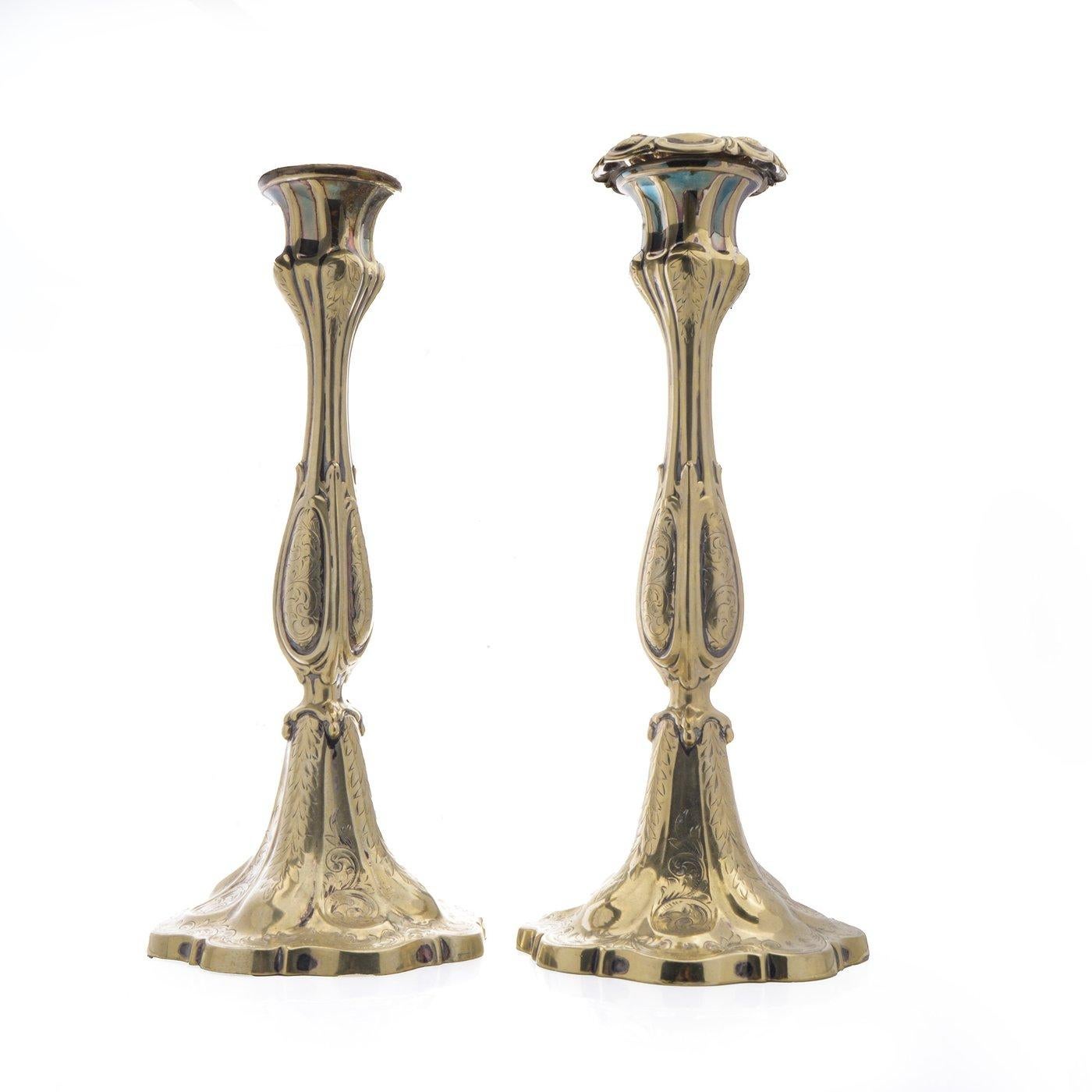 Antique Victorian Ornate Silver gilt Candlesticks.
Made in Circa 1890s.

Dimensions -
Diameter: 12 cm
Height: 23.5 cm
Weight: 1291 grams

Key Features:
Material and Finish:

Silver gilt , polished finish that enhances their ornate details.

Design: