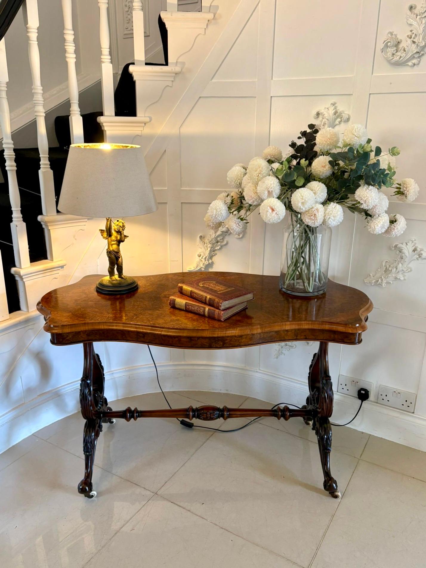  Antique Victorian outstanding quality burr walnut centre table having a magnificent quality burr walnut serpentine shaped top with a thumb moulded edge supported on acanthus leaf carved lyre end supports standing on shaped carved cabriole legs with
