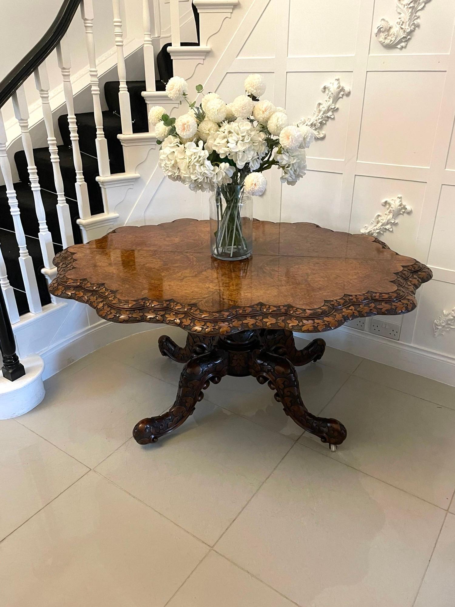 Antique Victorian outstanding quality carved burr walnut centre/dining table having a large magnificent quality serpentine shaped burr walnut top with a double serpentine shaped carved edge supported by an exquisitely carved solid walnut pedestal