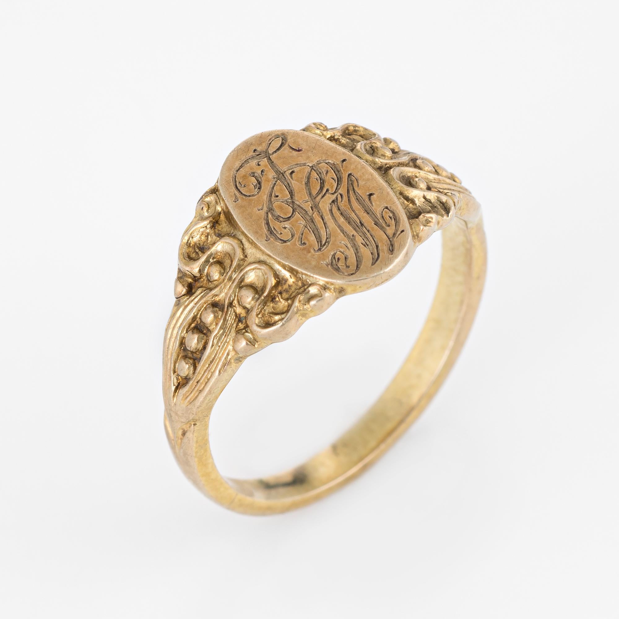 Lovely small antique Victorian signet ring (circa 1880s to 1900s), crafted in 10 karat yellow gold. 

The center oval is inscribed with the initials (from what we can decipher) 